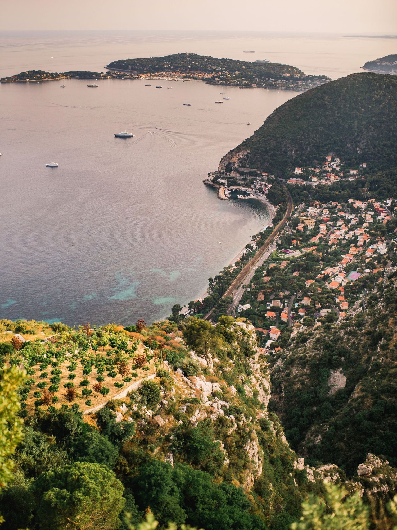 Panoramic coastal view of Eze in France.  Mediterranean village nestled on hillside overlooking blue waters.