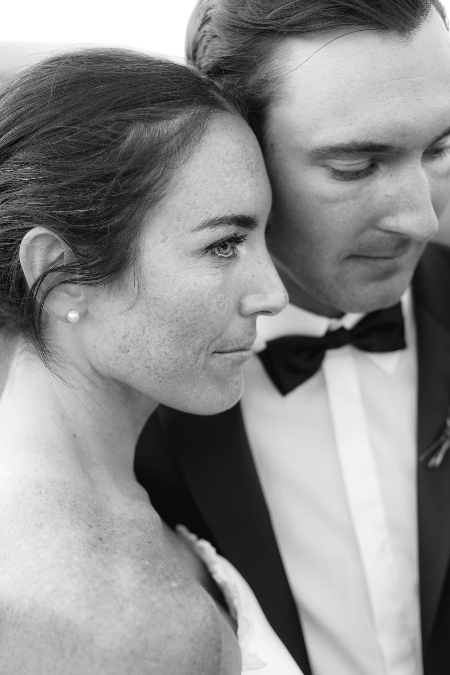 A romantic black and white photo series showing tender moments between a couple in formal attire.