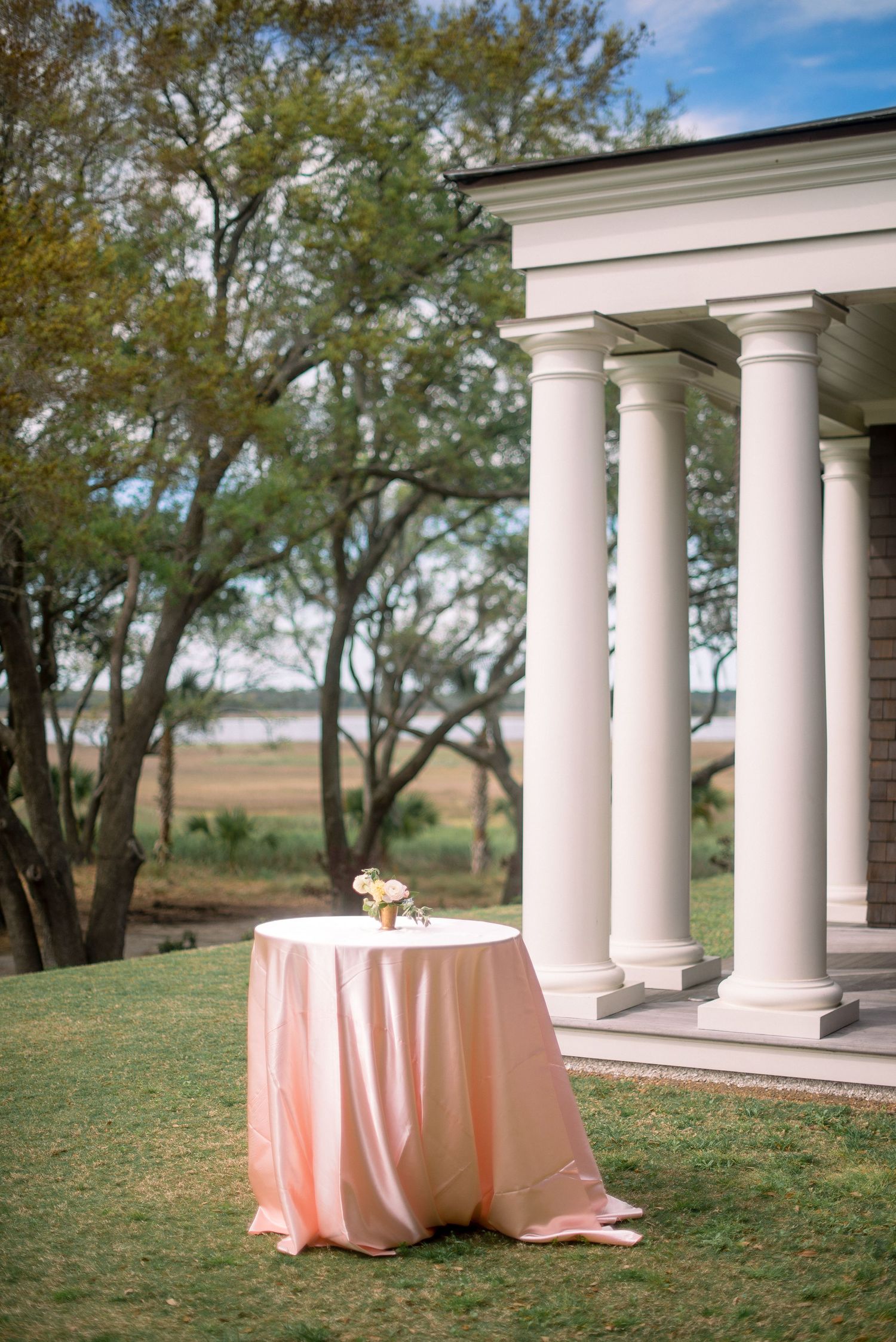 A sequence of outdoor photos showing white columns with a peach-colored tablecloth in a natural landscape setting.