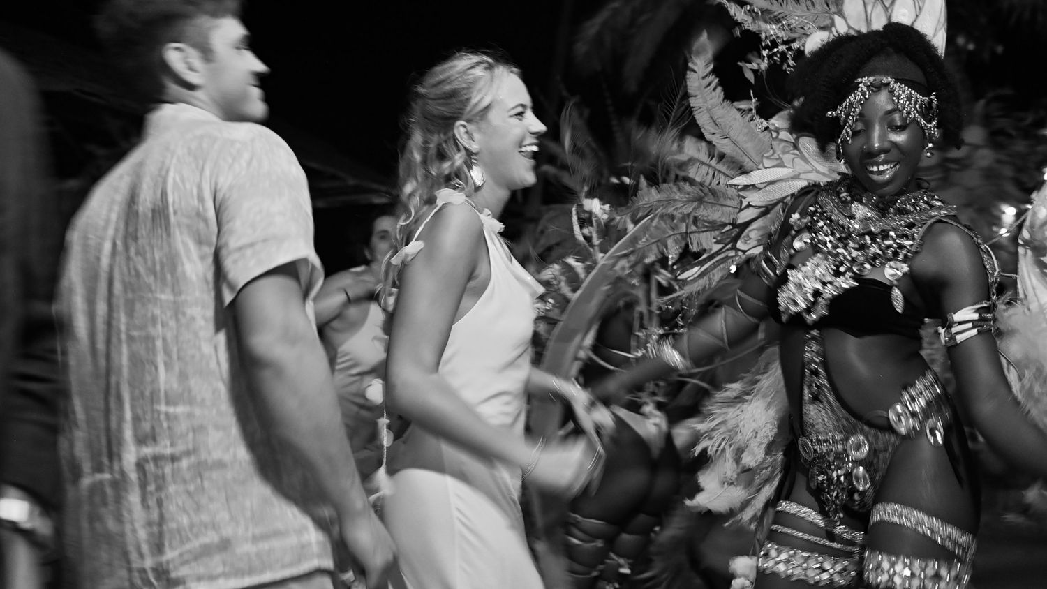 Black and white photos show people dancing and socializing at what appears to be a lively party or celebration.
