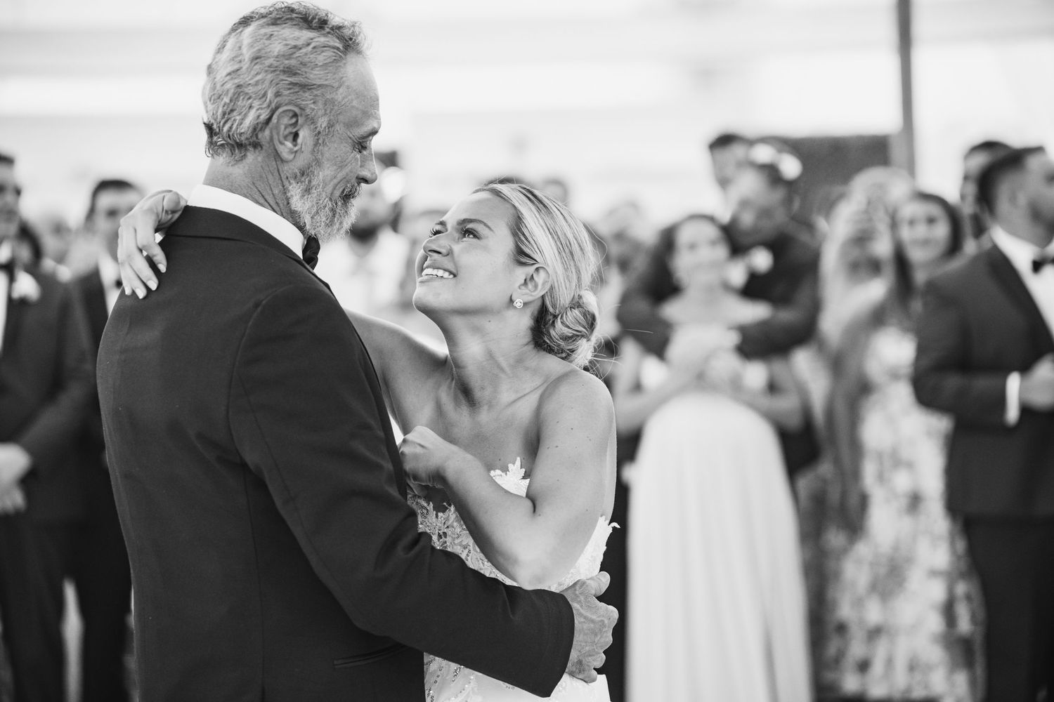Intimate black and white moment captured during a wedding dance.