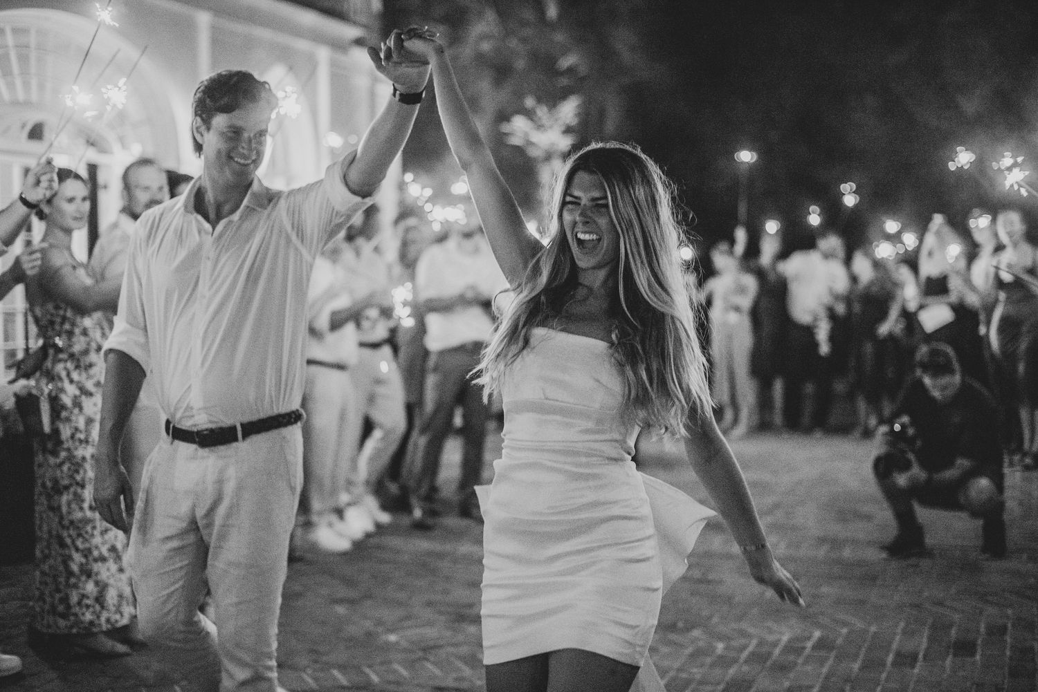 Black and white photographs showing people dancing and celebrating at a lively outdoor nighttime event.