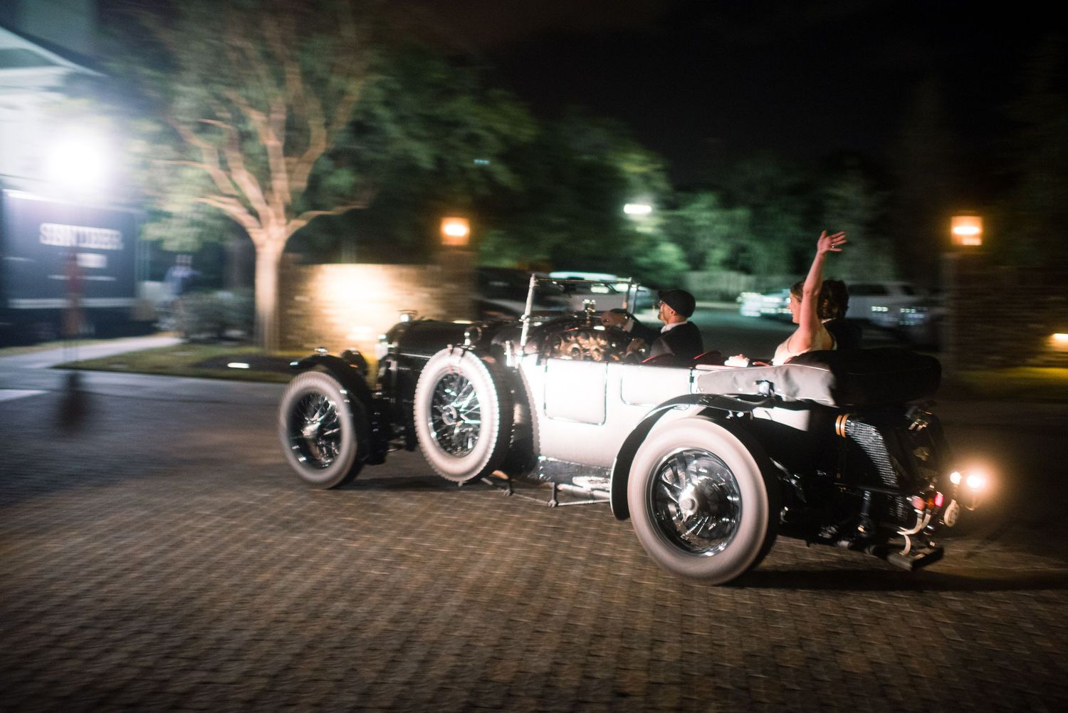 A sequence of nighttime shots showing a vintage motorcycle with sidecar illuminated by dramatic lighting effects.