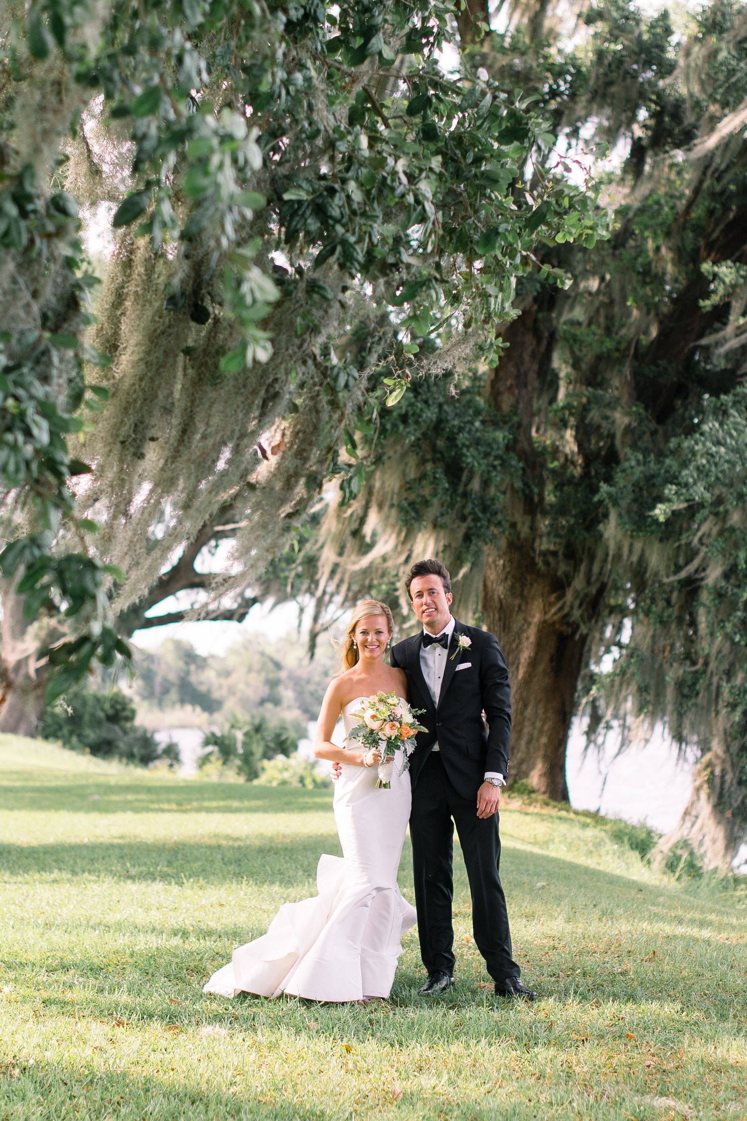 A romantic wedding photoshoot sequence under majestic oak trees draped with Spanish moss in a scenic outdoor setting.