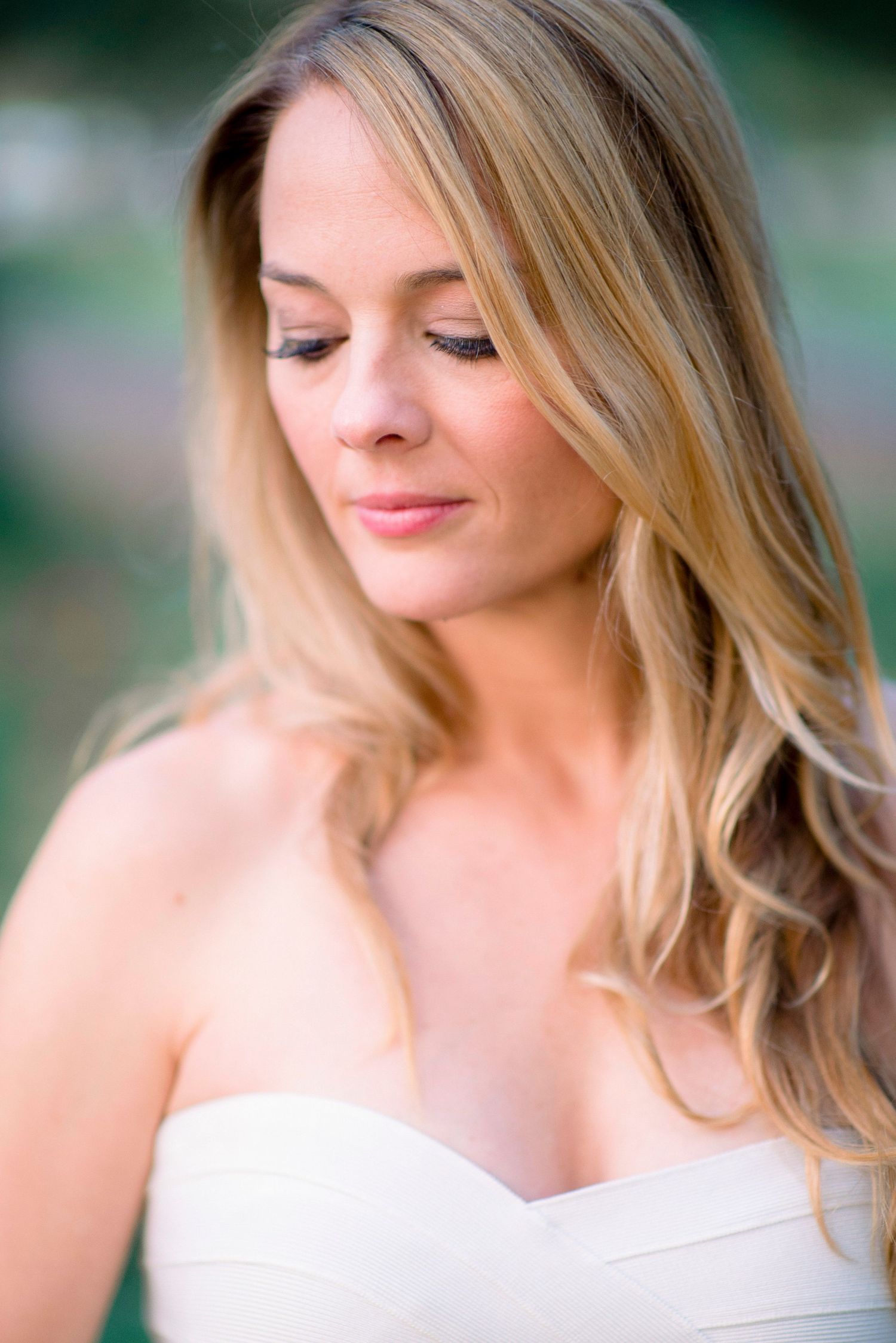 Close-up portrait shots showing delicate details of a white wedding dress.