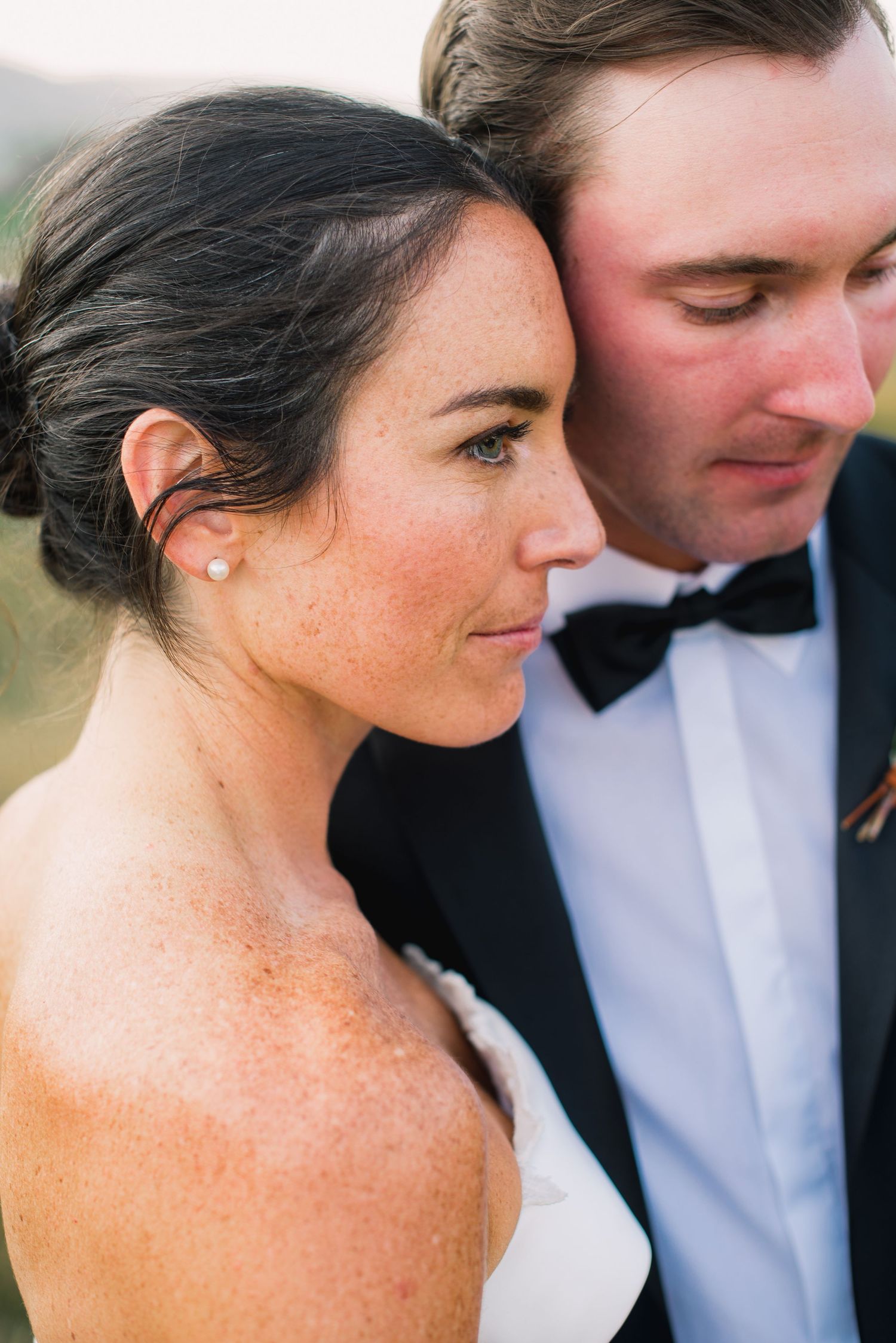 A series of intimate wedding portraits showing close-up details of a couple in formal attire.