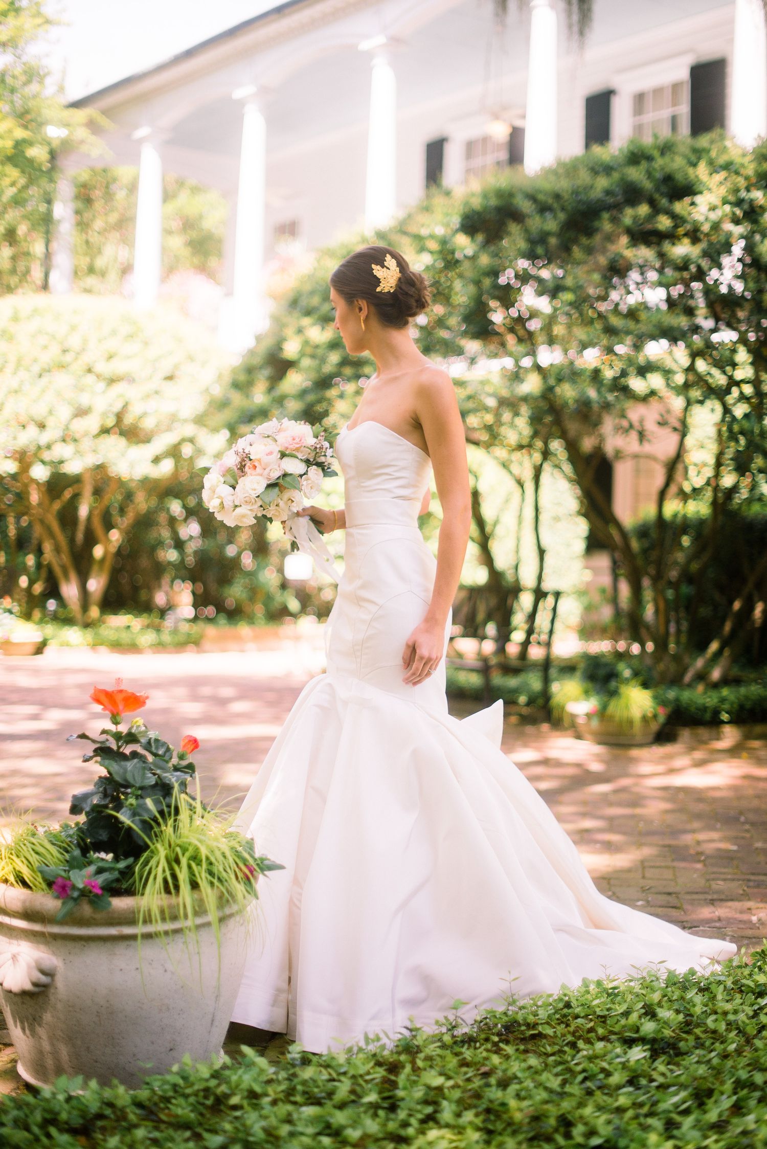 A series of romantic wedding dress photos showing flowing white gowns in a sunlit garden setting with lush greenery.