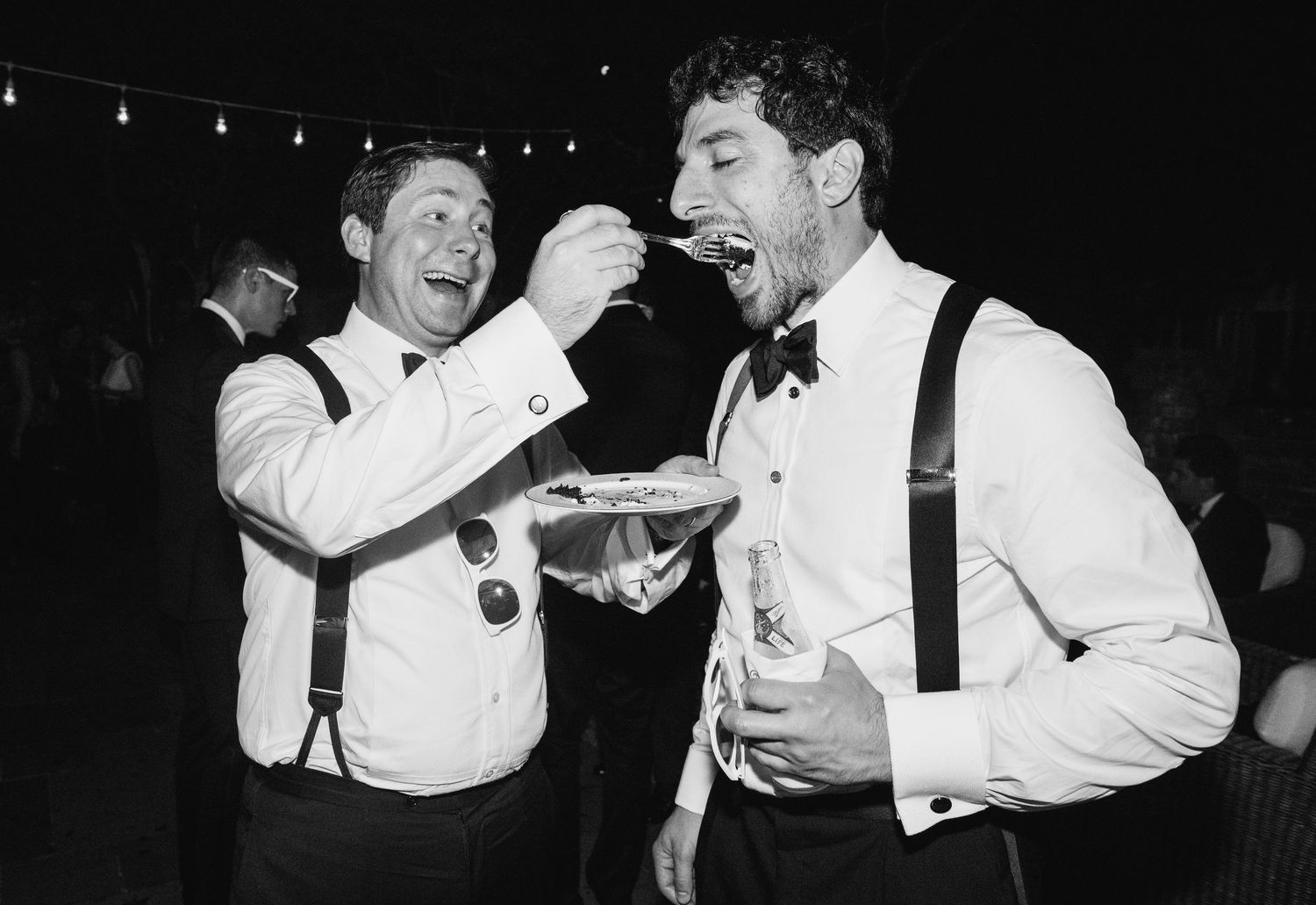 Black and white photos show performers in formal attire singing and dancing on stage during a show.