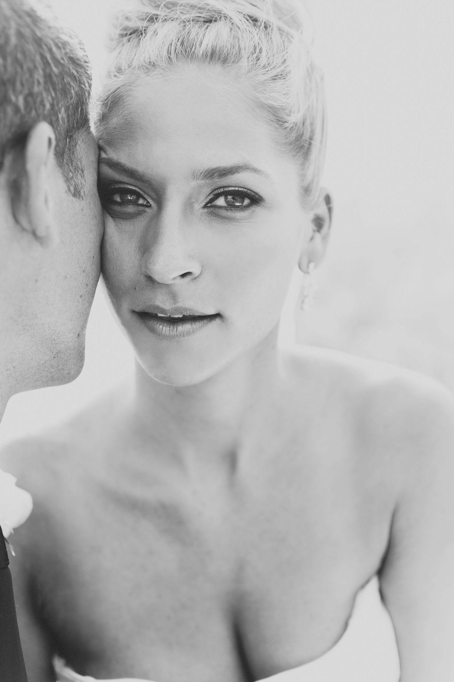 Black and white artistic portrait series showing close-up facial expressions in a minimalist style.