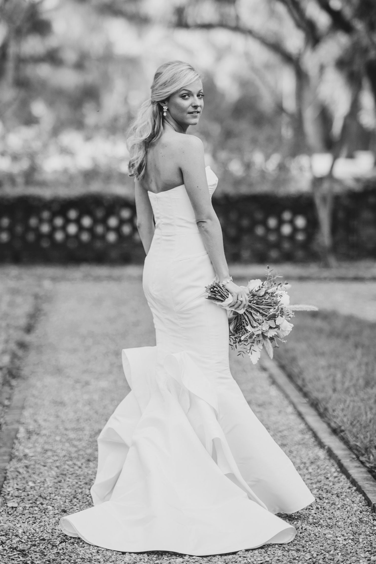 Black and white bridal portraits showcasing elegant mermaid wedding dress.