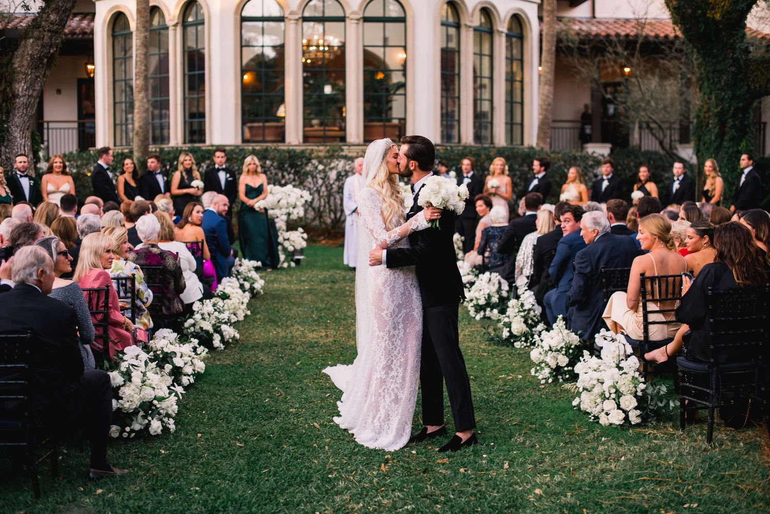 A collage of outdoor wedding ceremony photos showing floral arrangements and guests seated on a lawn at dusk.