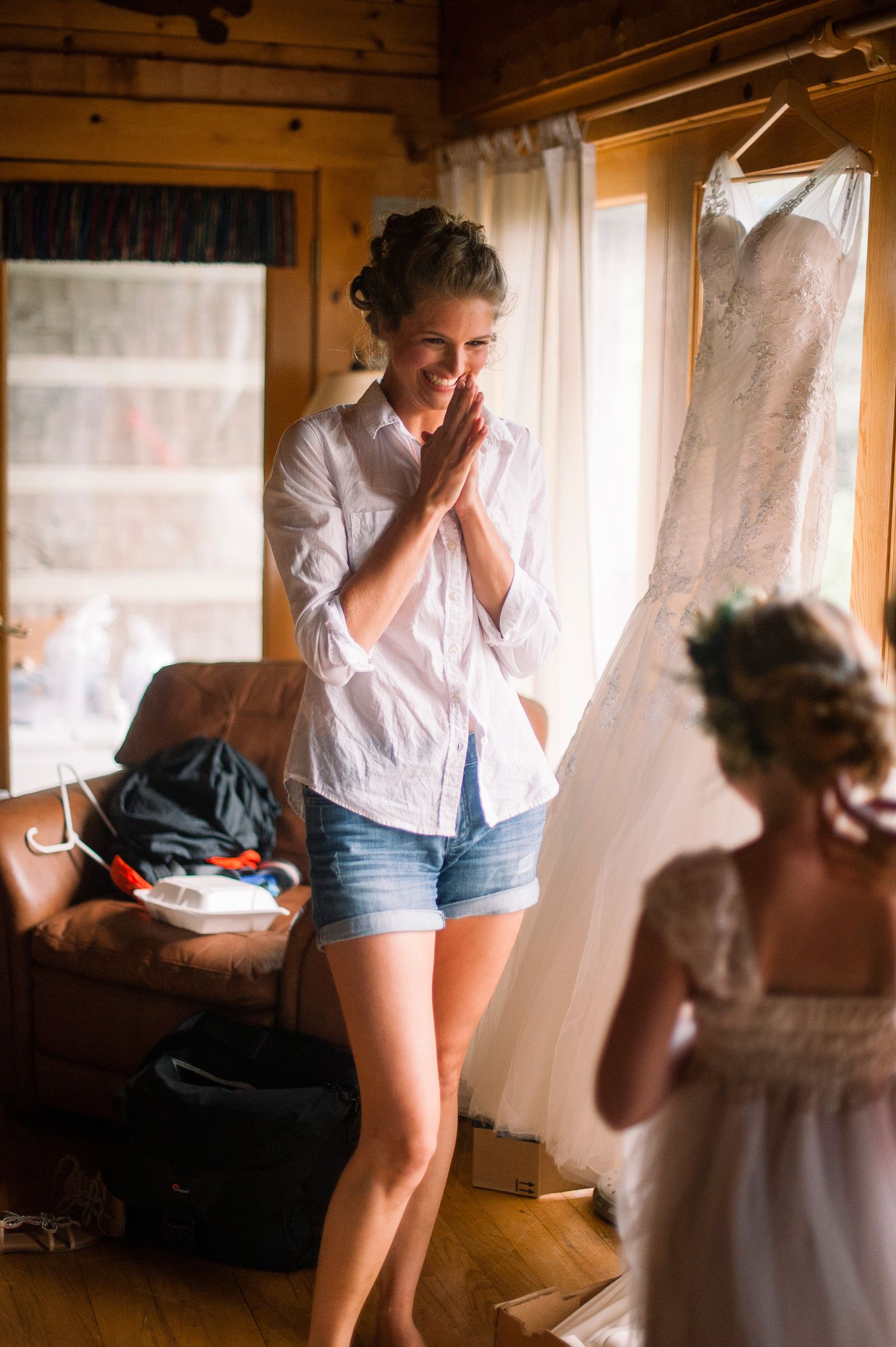 A sequence of candid photos shows a person in denim shorts and white shirt leaning against a window in warm sunlight.
