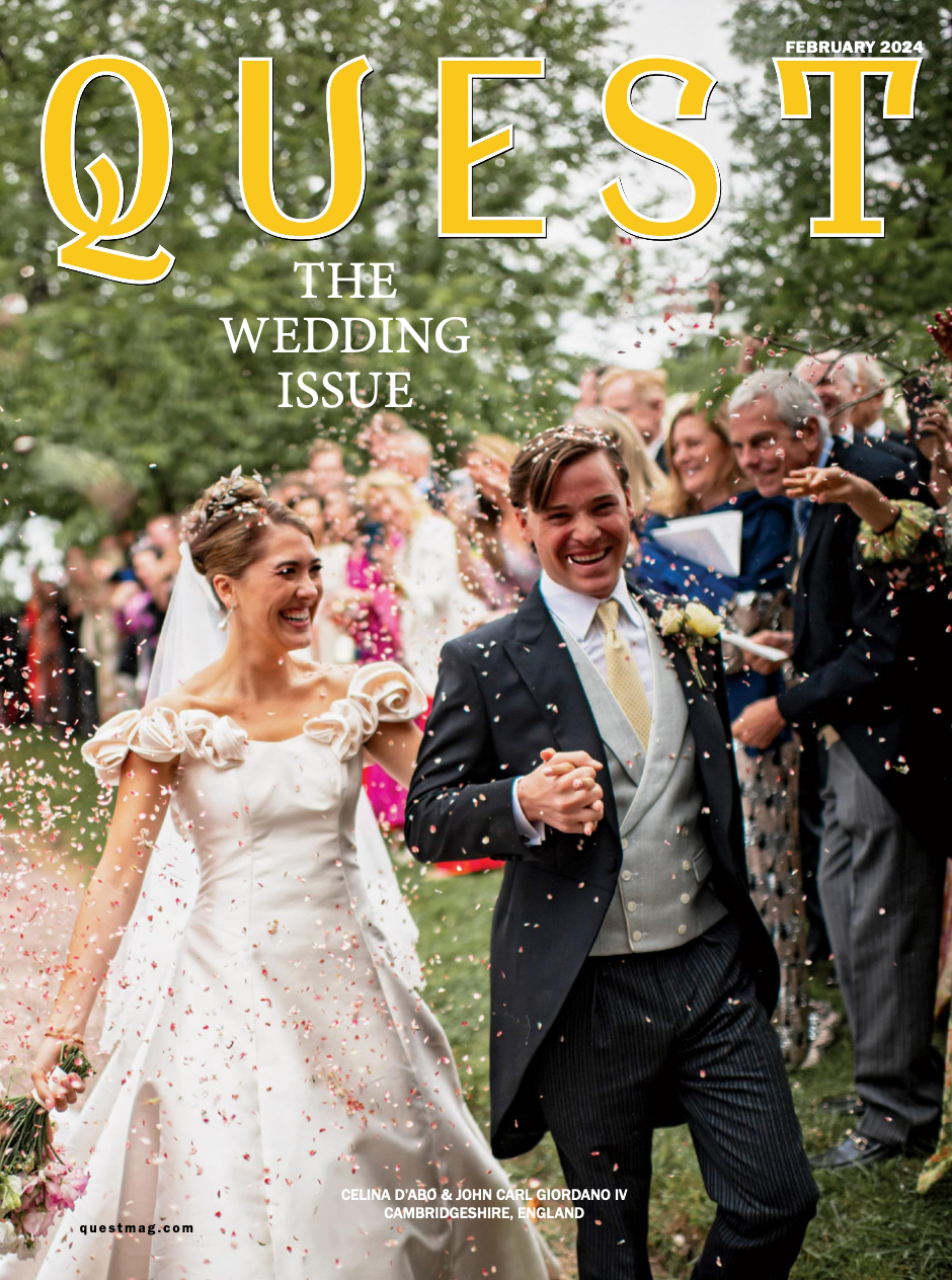 Joyful wedding party celebrates outdoors with confetti flying through the air during a sunny celebration.