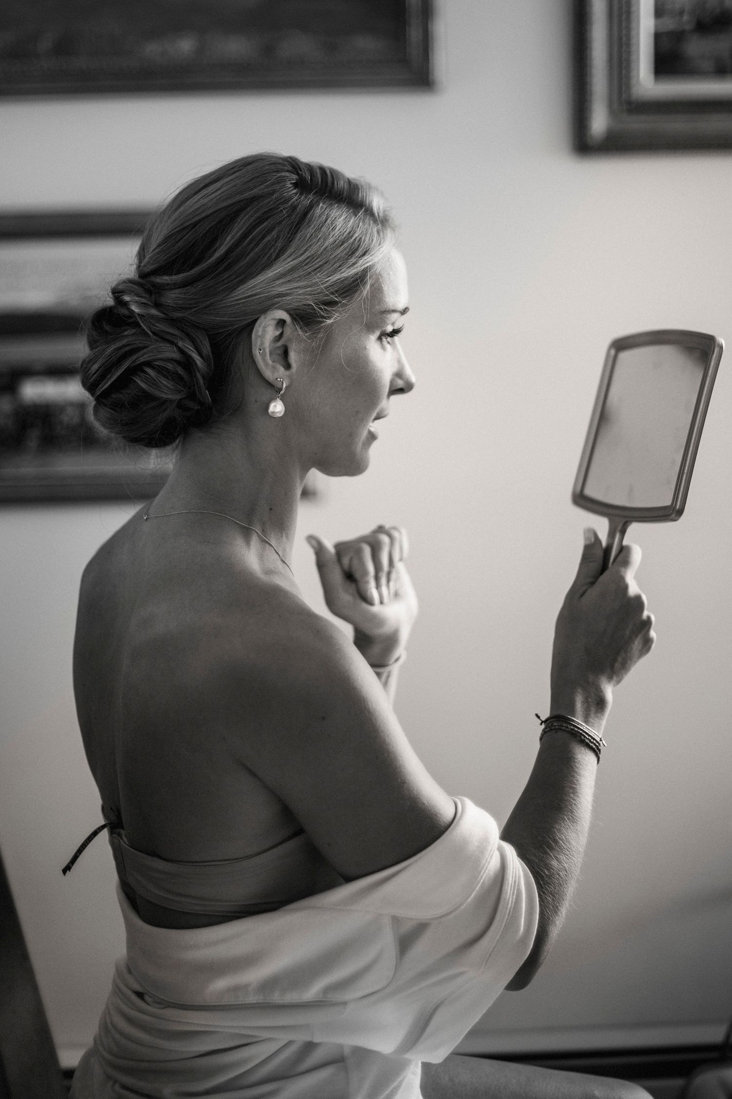 Black and white series showing preparation moments with hand mirror and getting ready.