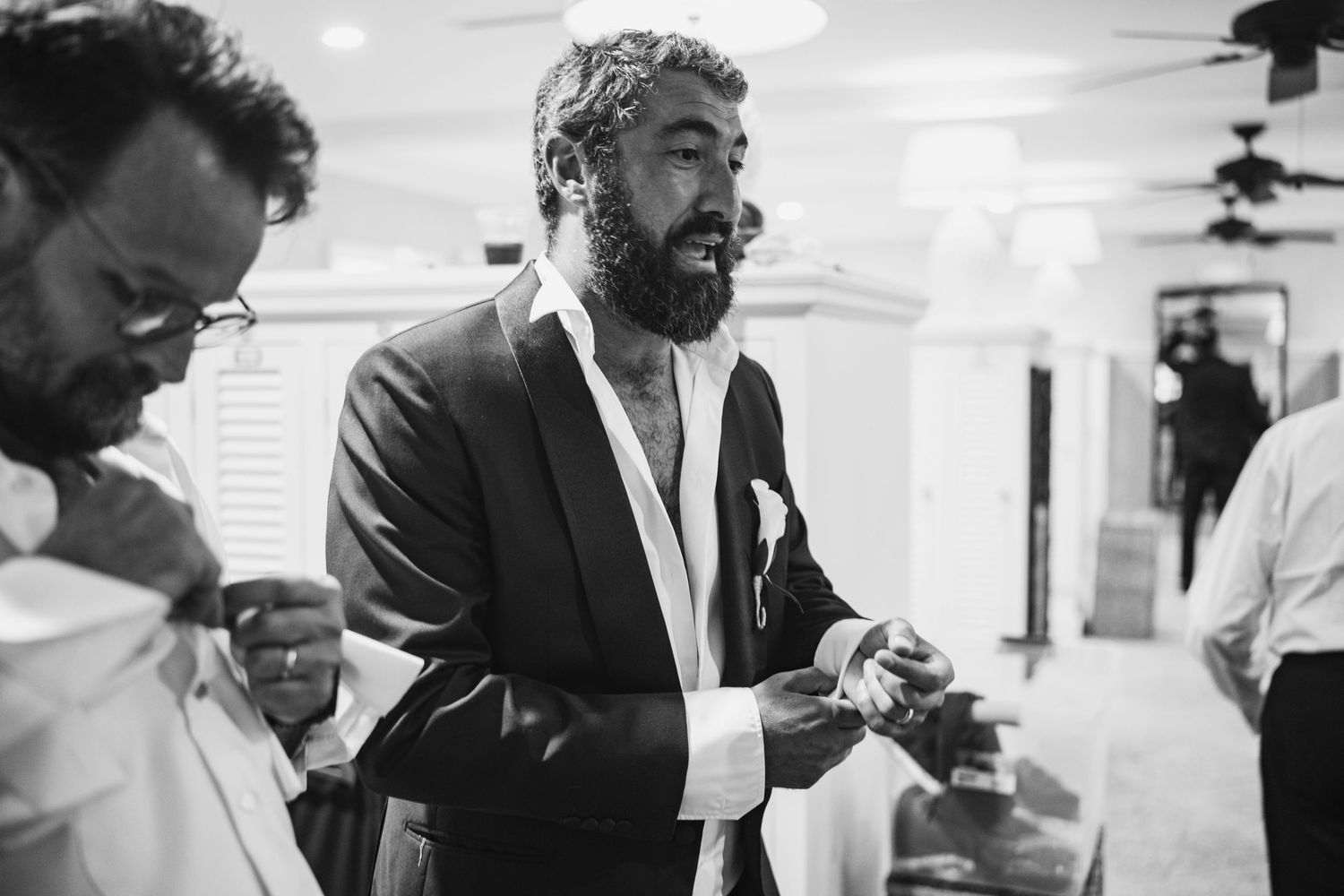 A series of black and white photos showing people in business attire interacting and working in an office setting.