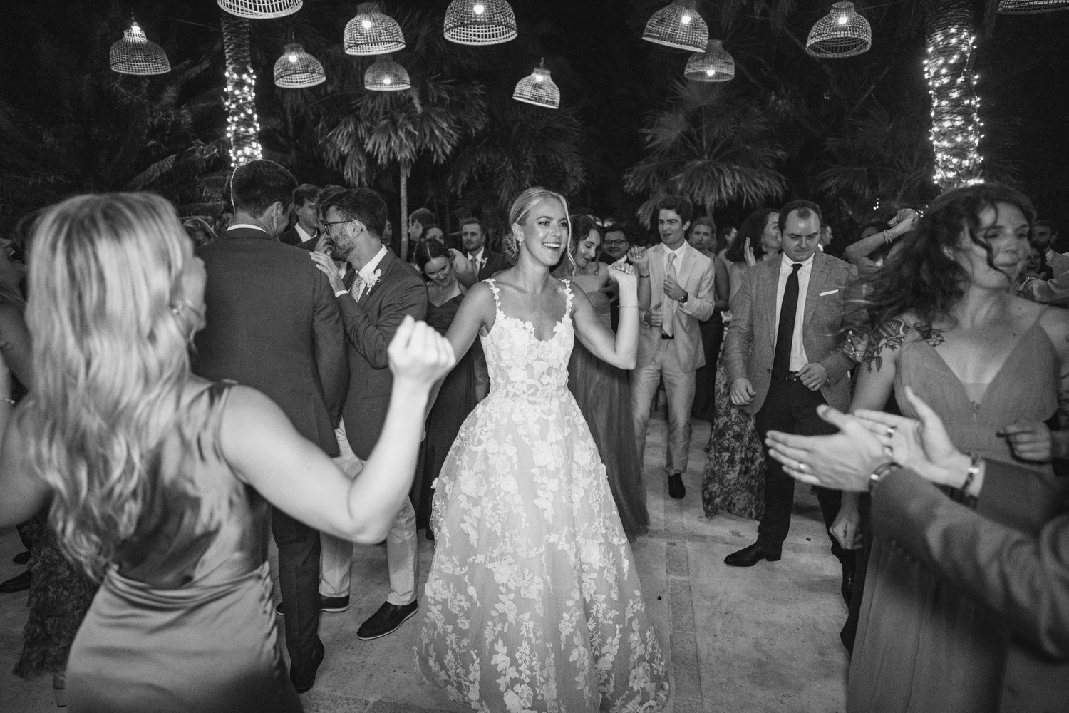Black and white photos of a lively wedding reception dance party.