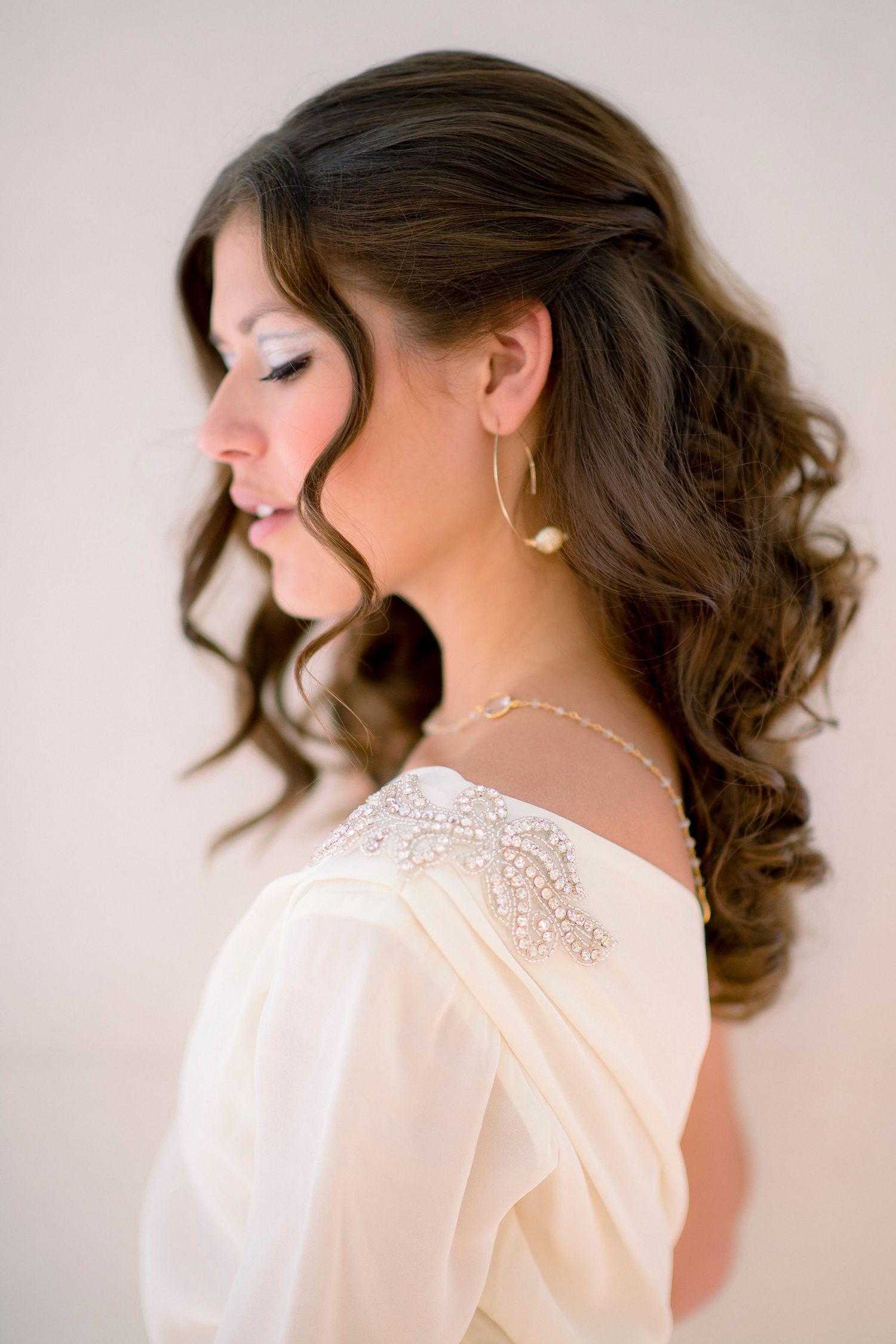 Elegant bridal portrait series showing delicate lace details and soft styling.