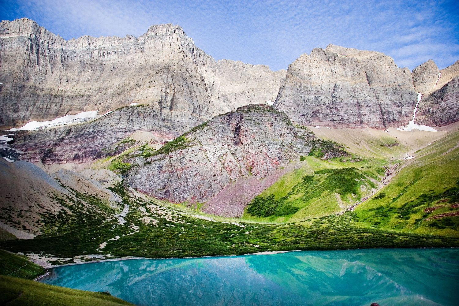 A panoramic series of mountain landscapes with turquoise alpine lakes surrounded by rocky peaks and green valleys in Glacier Park, Montana