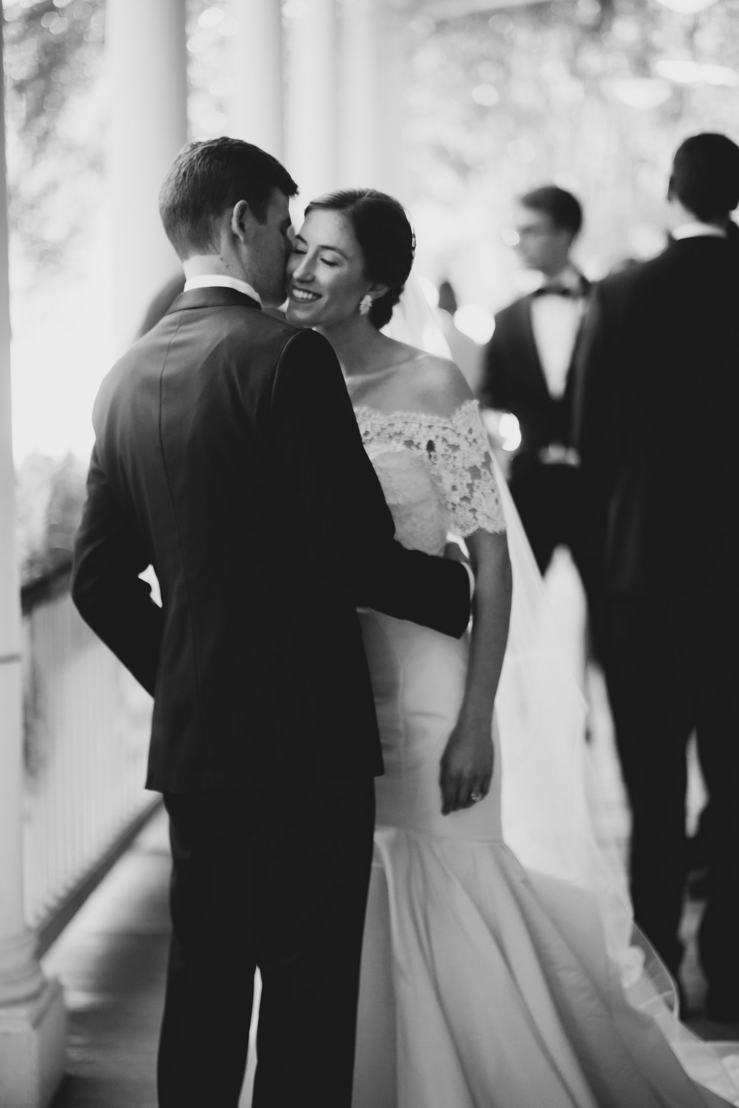 Black and white wedding photos showing couples dancing together at a romantic reception celebration.