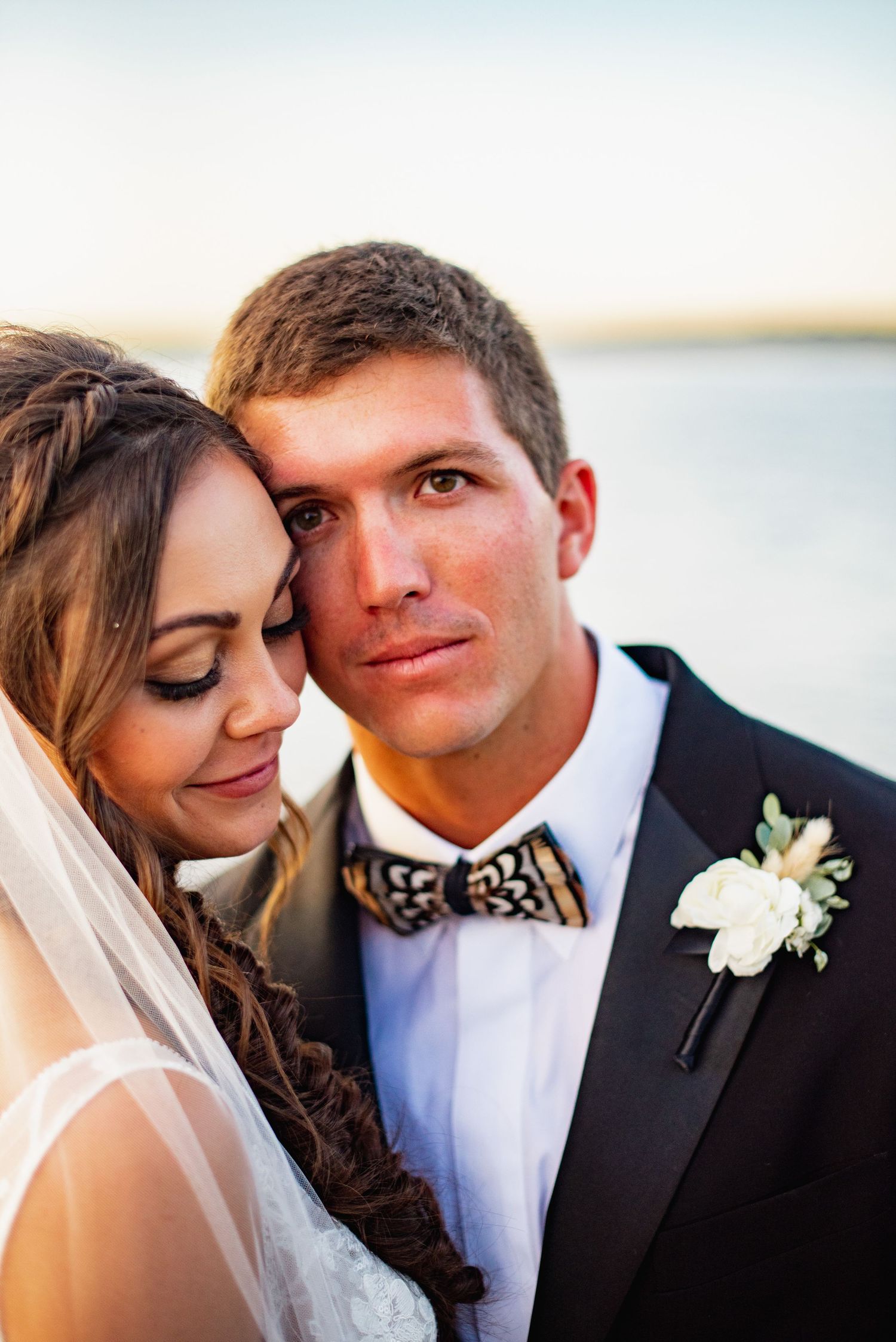 A romantic wedding photo sequence showing tender close-up moments between newlyweds against a soft background.