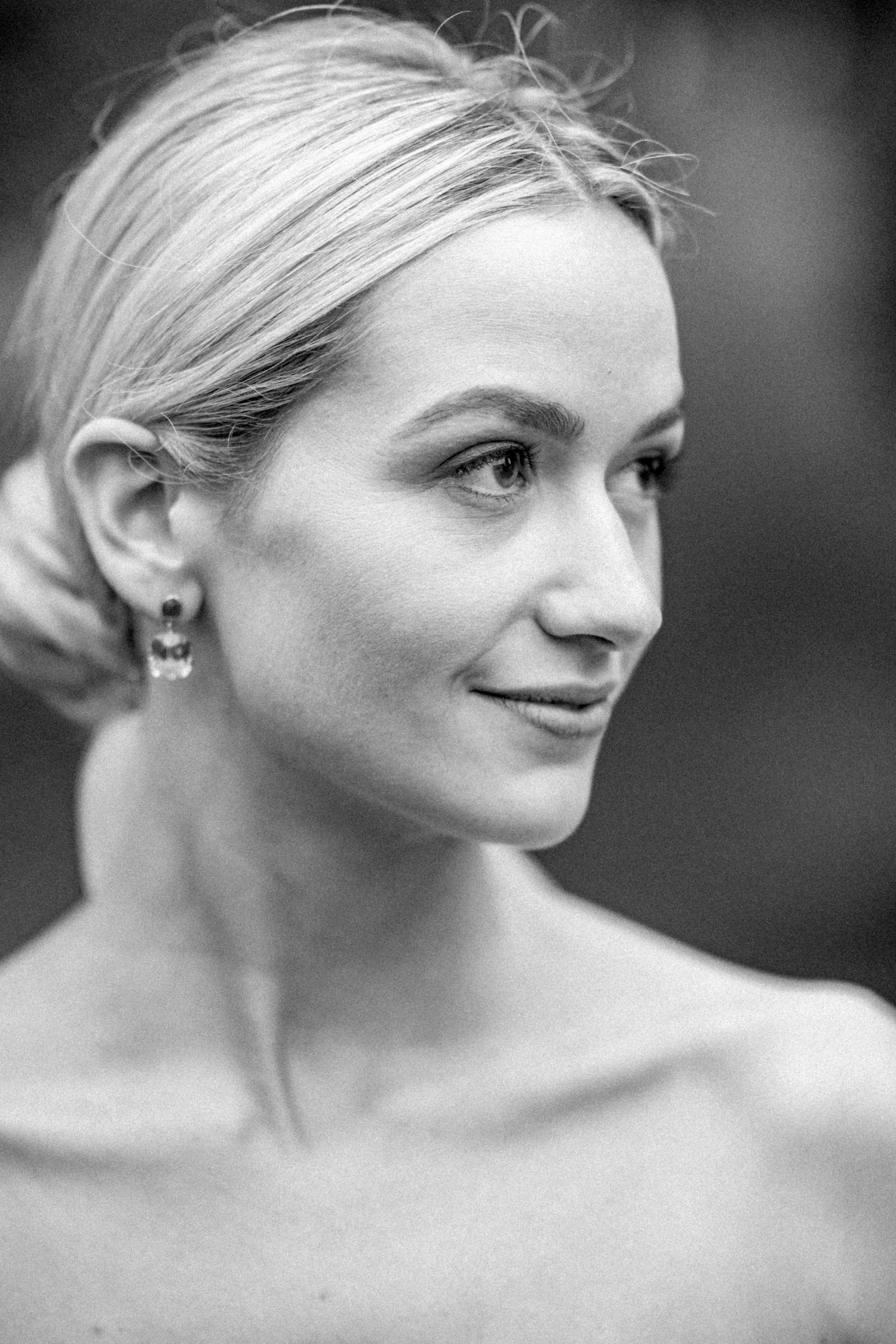 A series of black and white close-up portraits showing different expressions and angles.