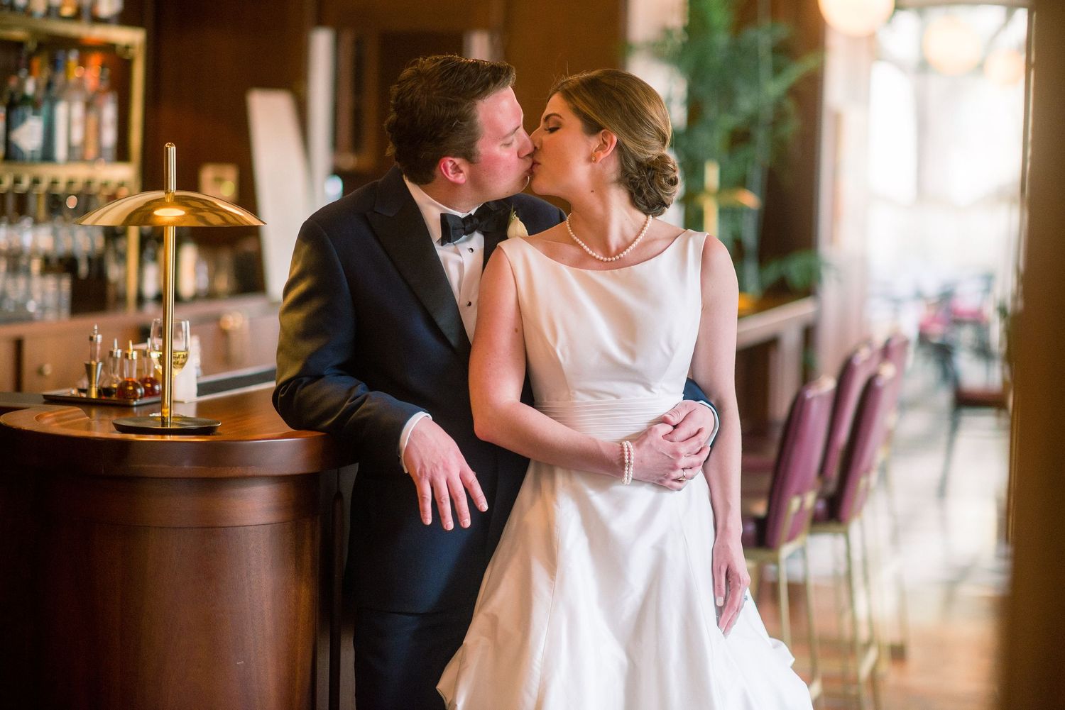 A romantic couple shares an intimate moment together in a rustic restaurant setting.