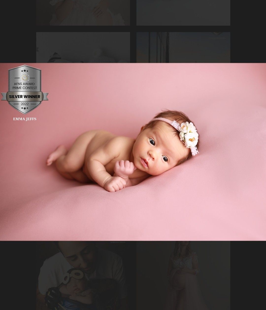 An award winning image of baby girl beautifully posed against a soft pink backdrop, full of charm and personality.