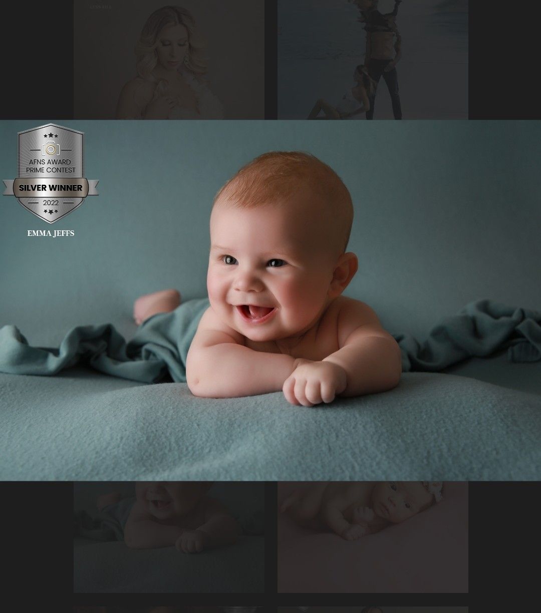 An award winning portrait of baby boy set against a rich green backdrop, capturing personality and warmth.