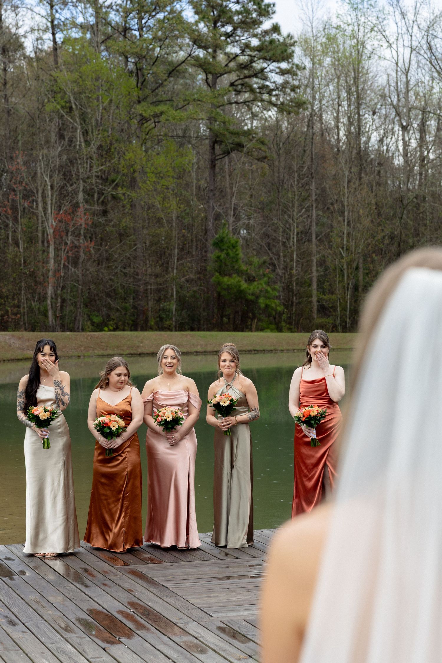 Emotional bridesmaids in rust and champagne gowns react with tears to bride's first look reveal.