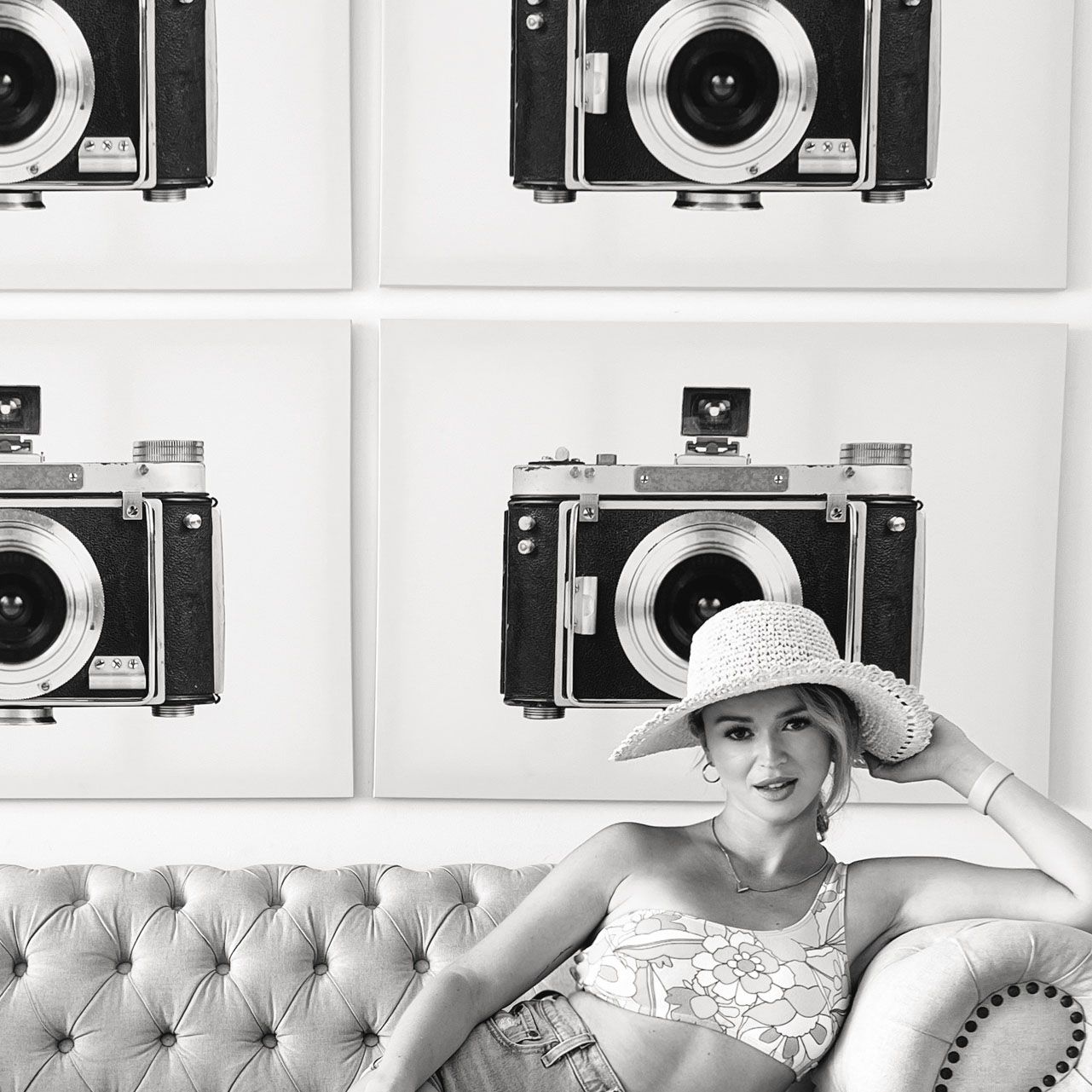 Black and white photo collage of vintage cameras and photography equipment displayed on white background.