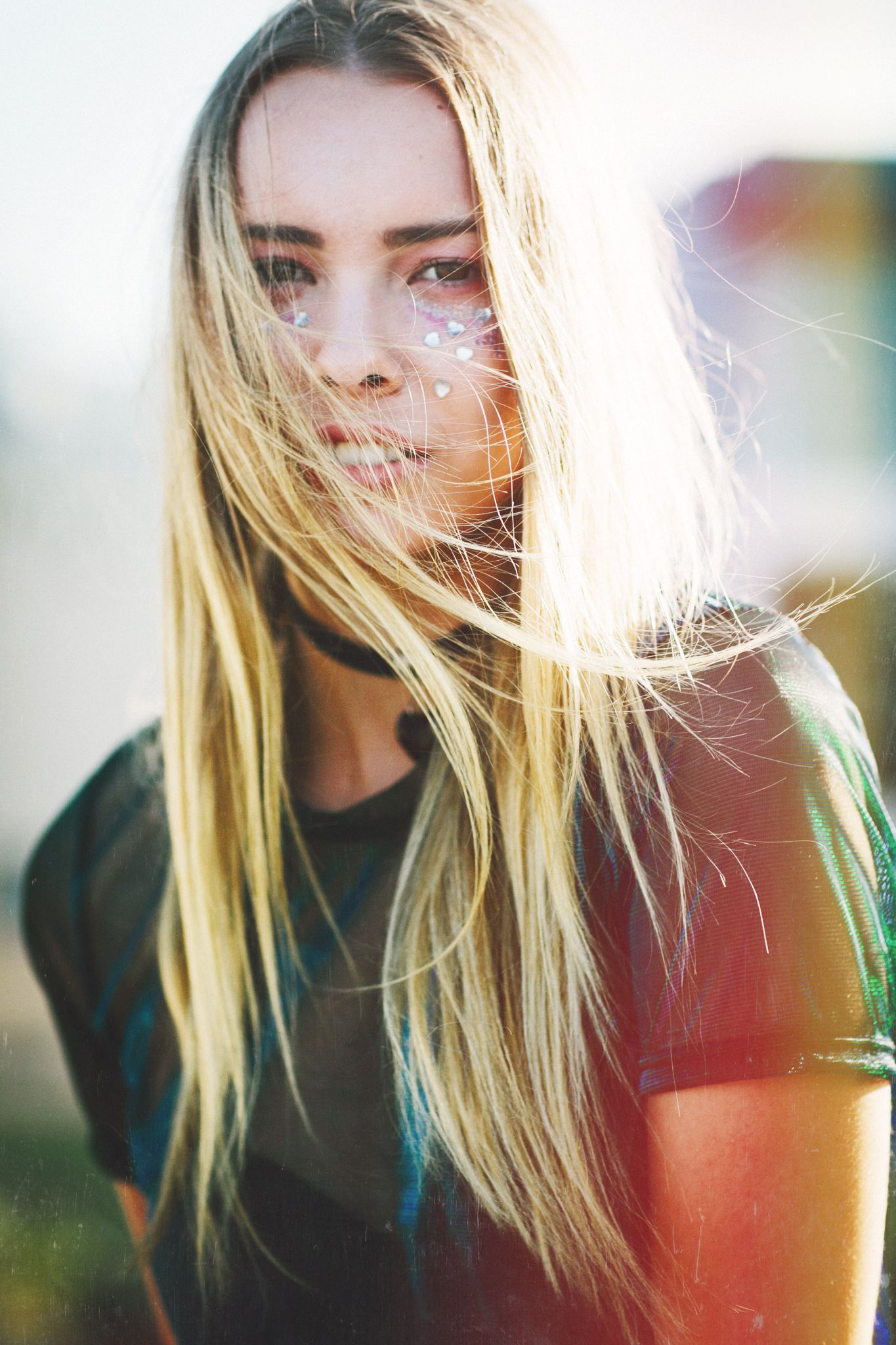 Artistic portrait series with backlit blonde hair and dramatic lighting.