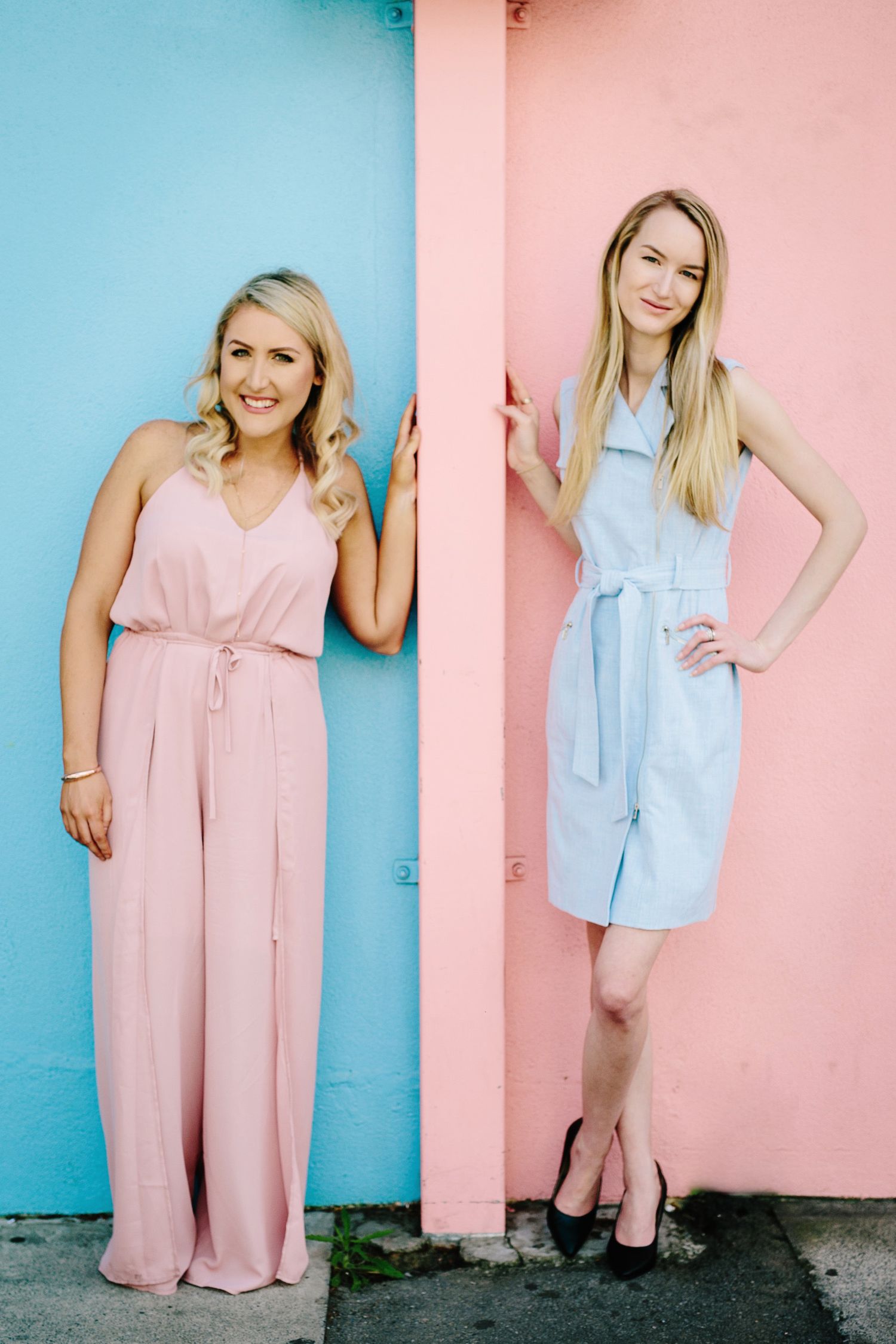 A series of fashion photos showing a pink jumpsuit and blue jacket styled against contrasting pink and blue walls.