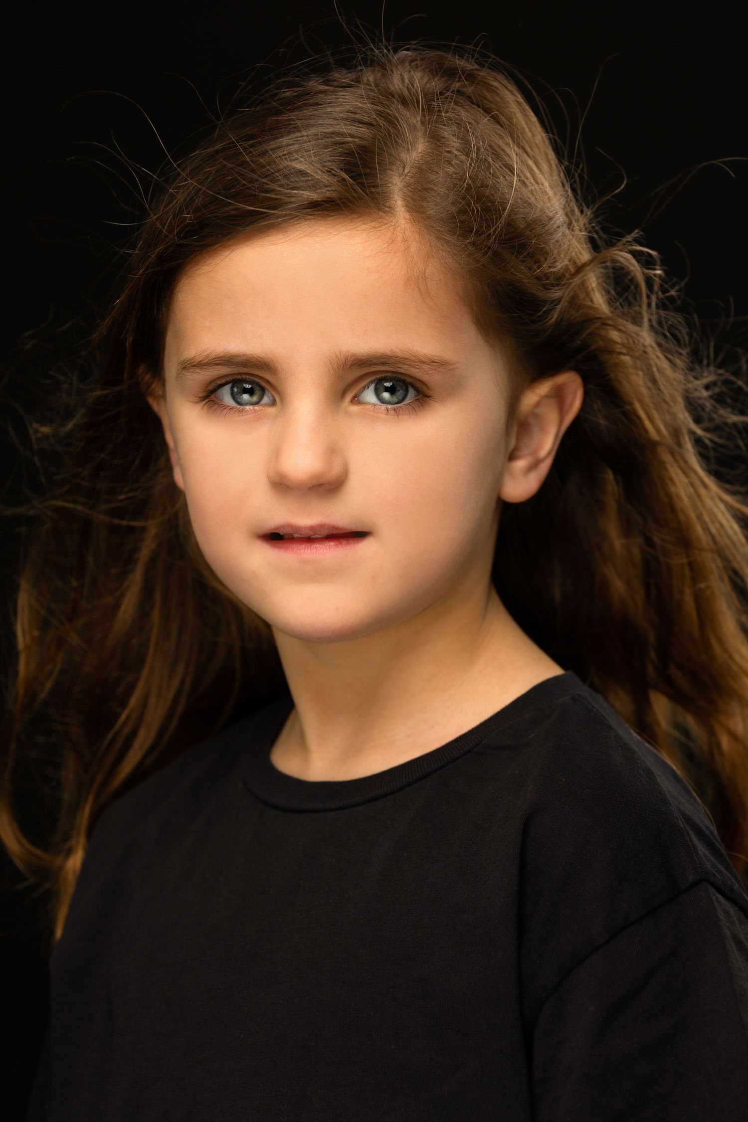 Portrait sequence showing close-up side profile views at different angles against dark background.