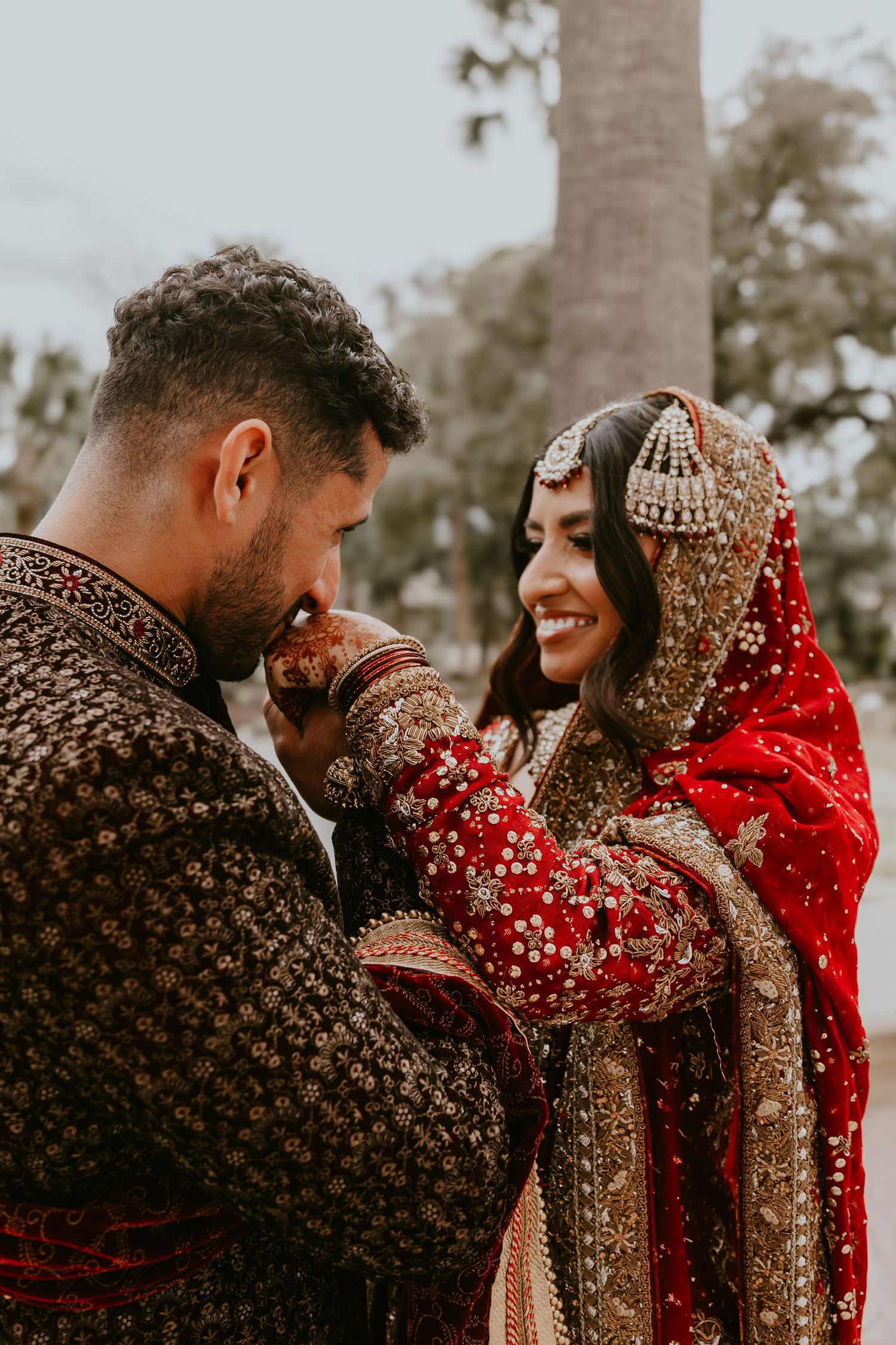 A series of romantic frames showing a couple in traditional Indian wedding attire sharing intimate moments during their ceremony.