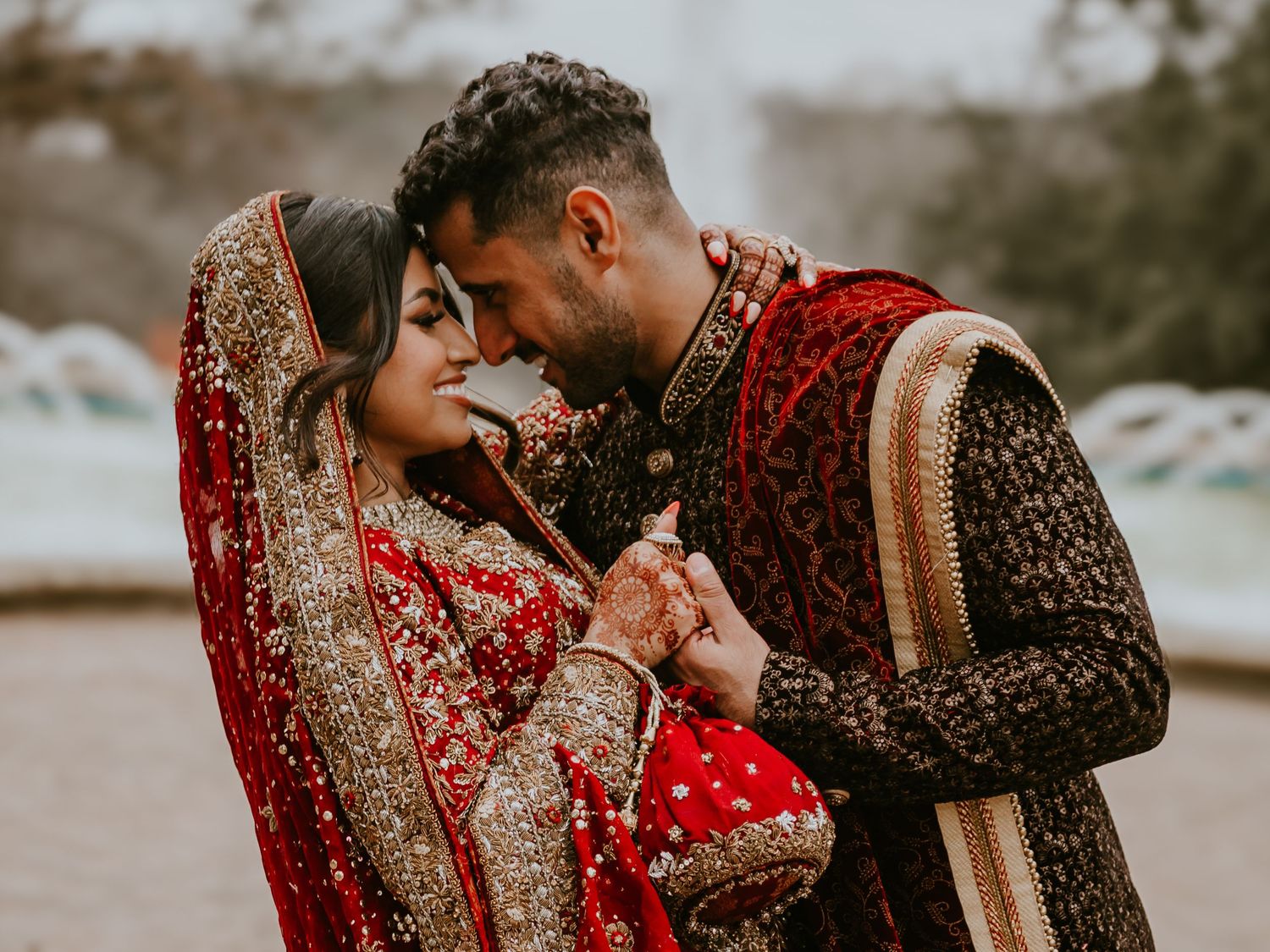 Romantic couple shares an intimate moment outdoors.