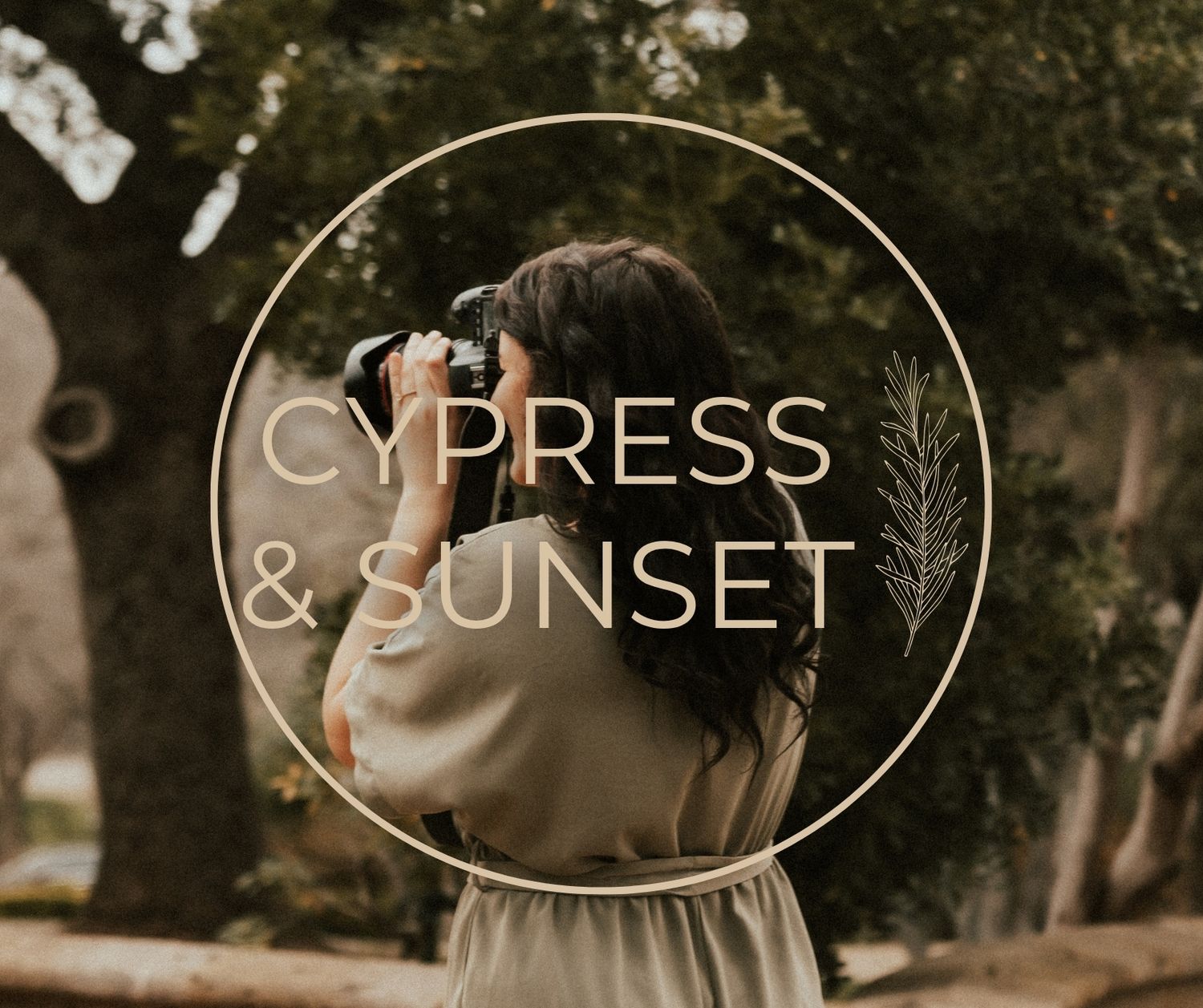 A wedding couple stands facing each other in a picturesque outdoor setting with sunlight filtering through trees.