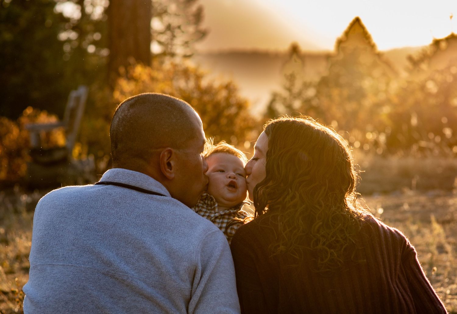 Couple and baby at Mt. Falcon Park in Jefferson County, CO