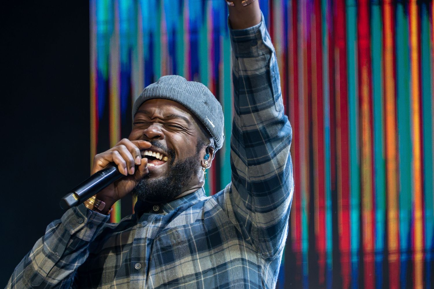man singing into a microphone worshiping at Zeal Church, Colorado Springs. Photo by Elijah Grace Photo