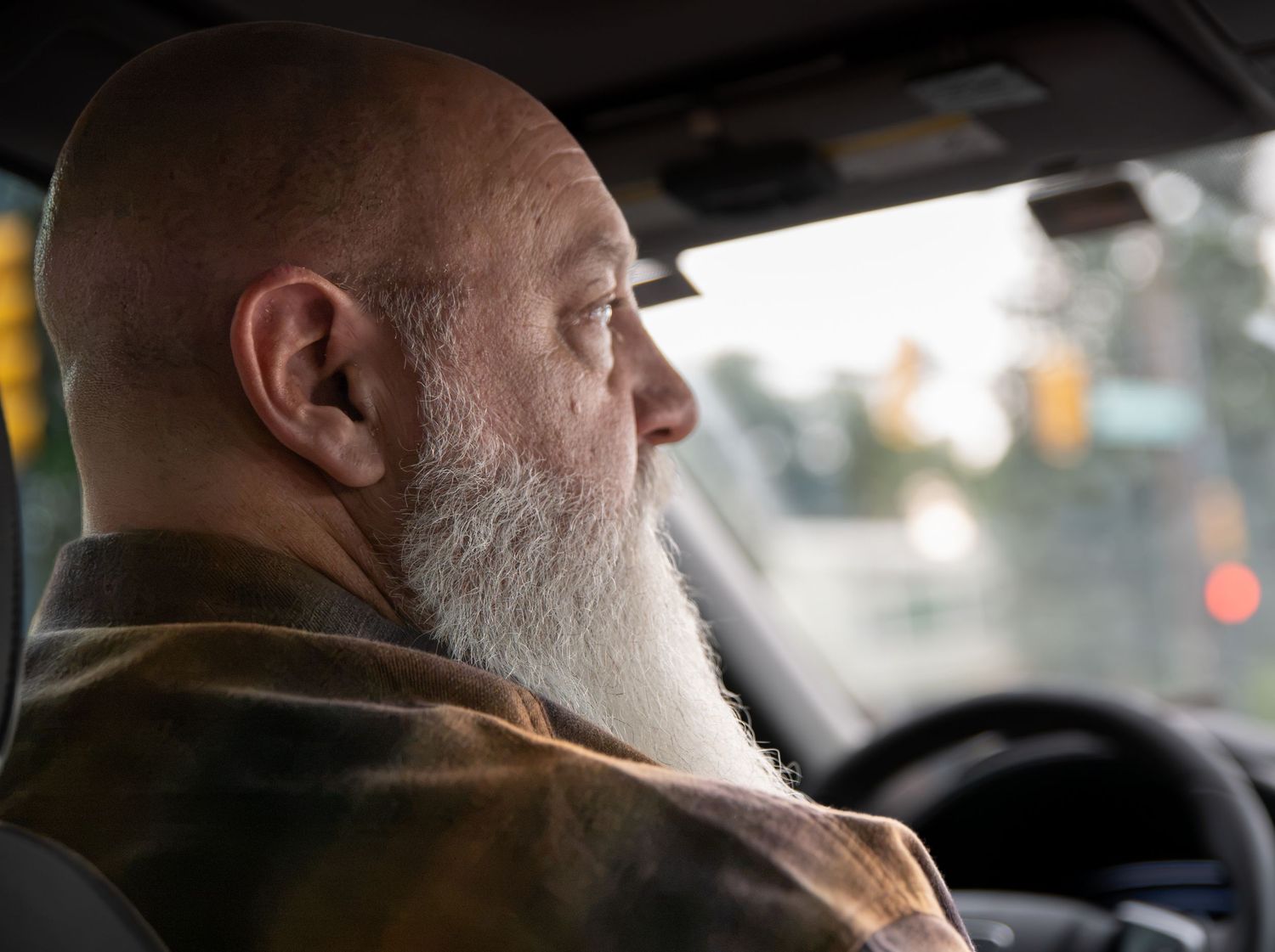Side profile portrait of a man driving. Photo by Elijah Grace Photo.