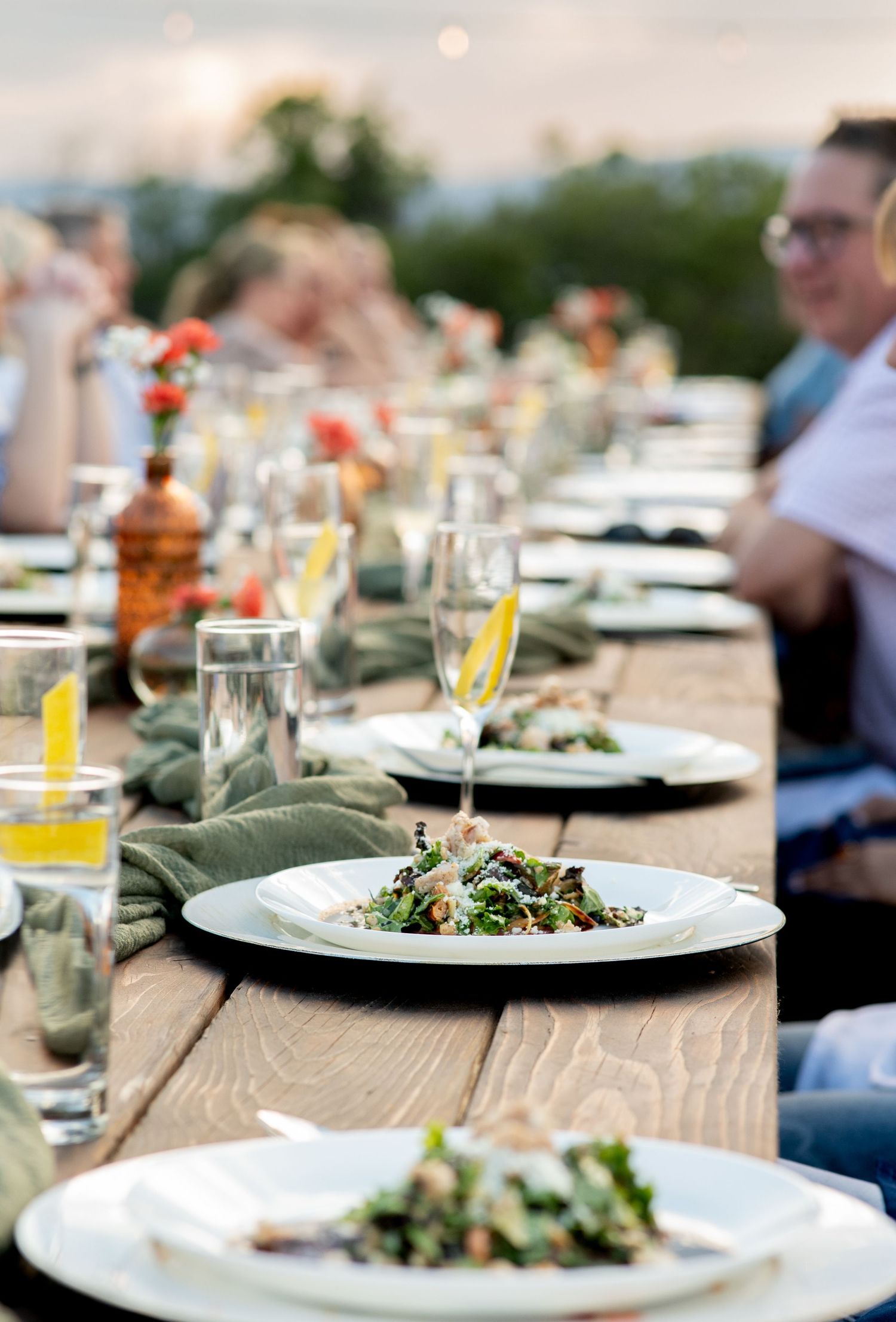 Salads on plates at an event. Photo by Elijah Grace Photo