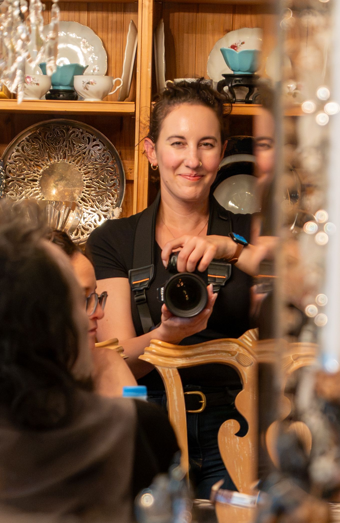 Elijah taking a self portrait in a mirror. Photo by Elijah Grace Photo.