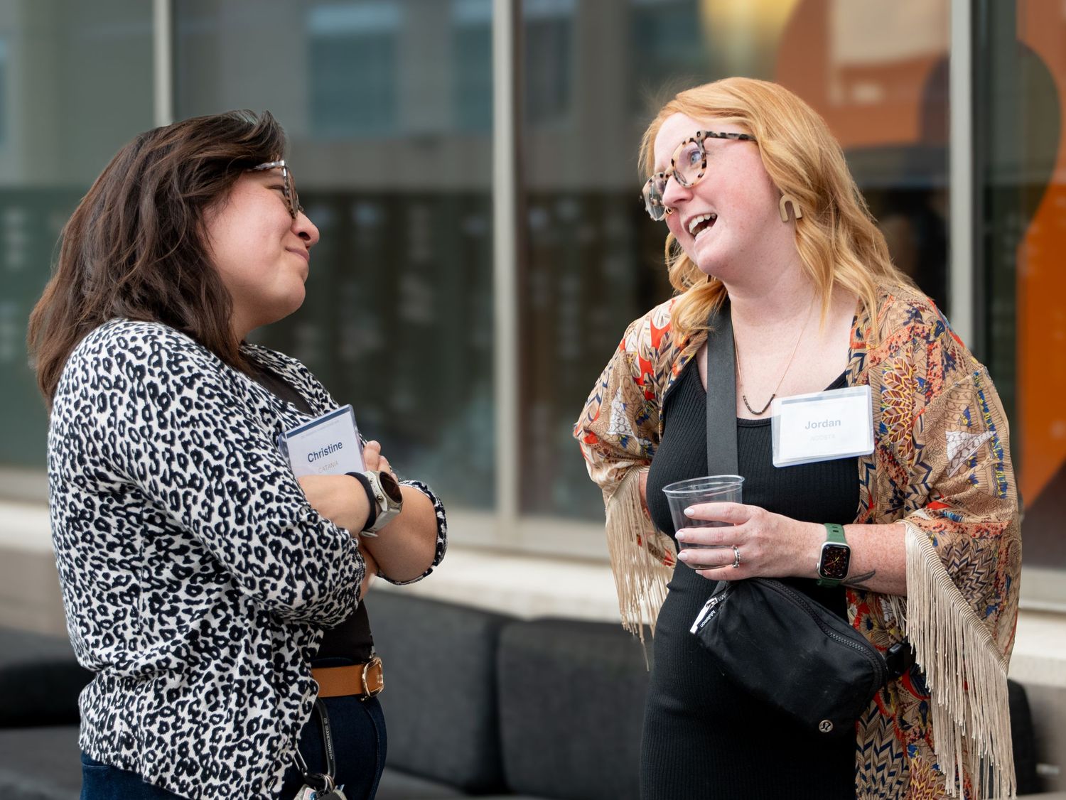 Professionals talking at Denver People Leaders Summer Soiree at Janus Henderson in Denver, CO