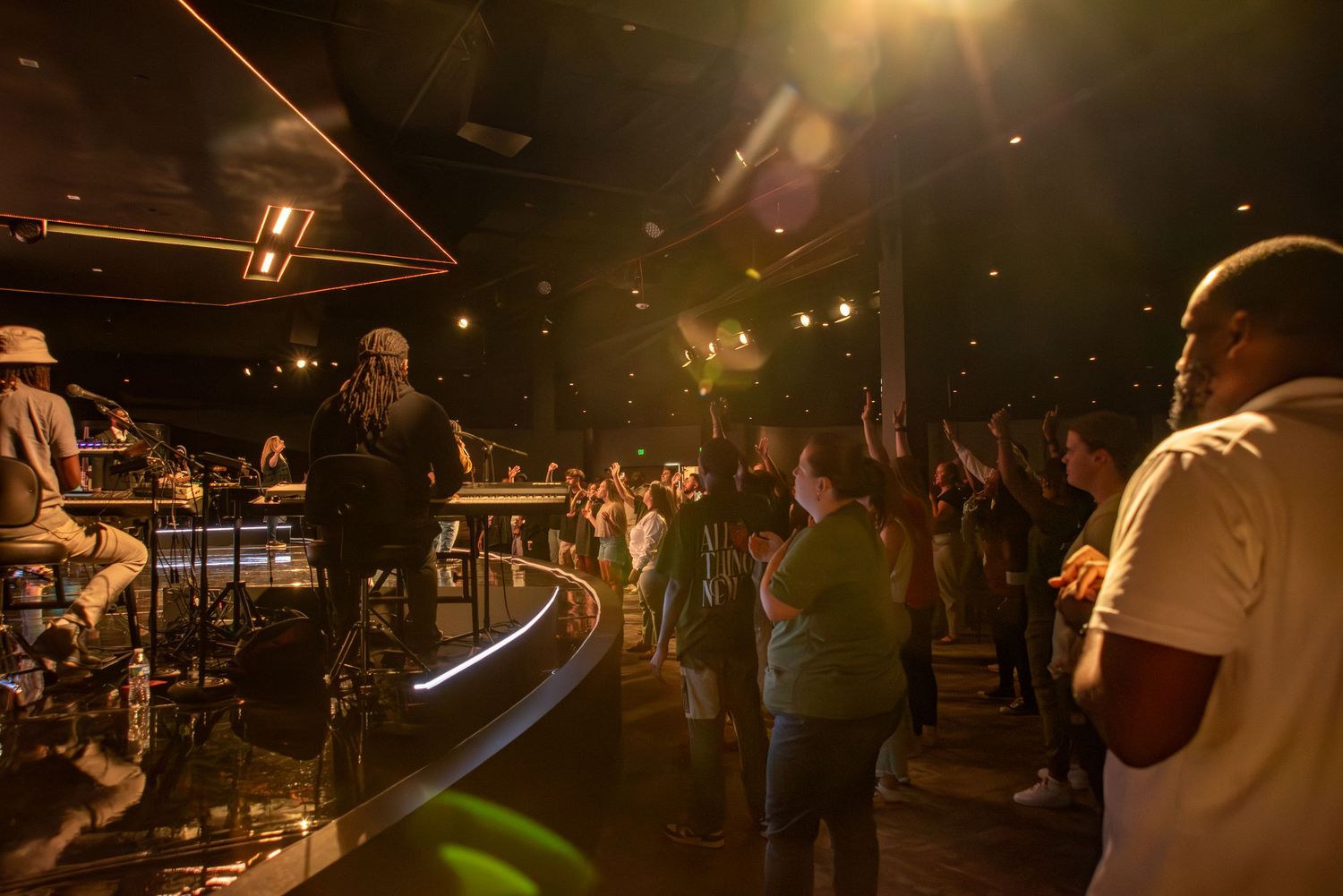 Congregation worshiping in a modern church