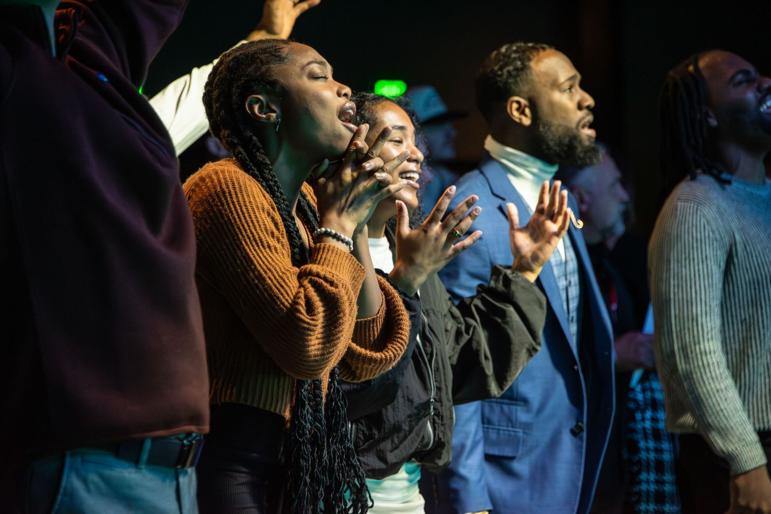 people with hands raised for worship at Zeal Church, Colorado Springs. Photo by Elijah Grace Photo