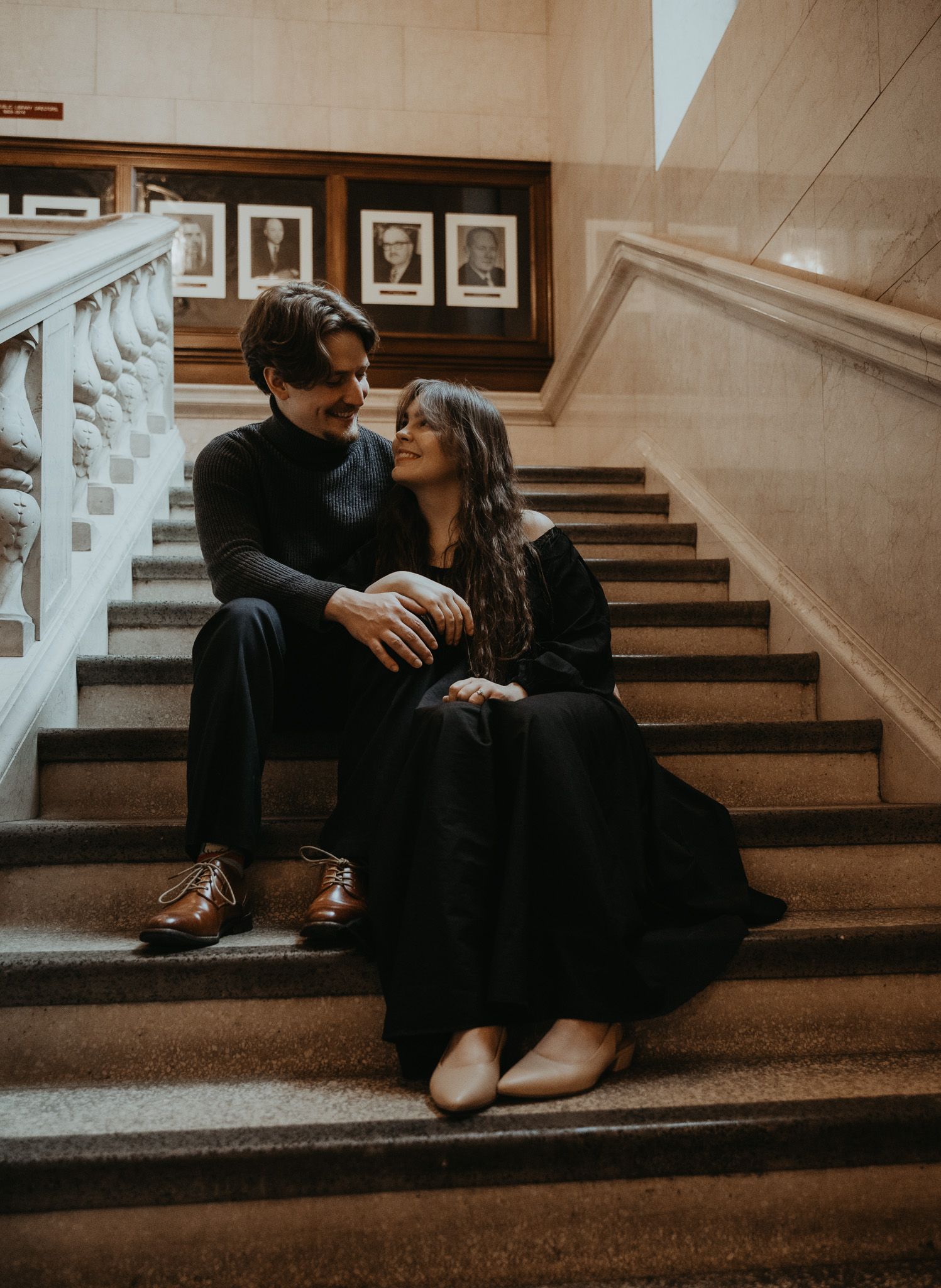 A warm-toned photo sequence captures a couple sharing tender moments while sitting on indoor stairs.