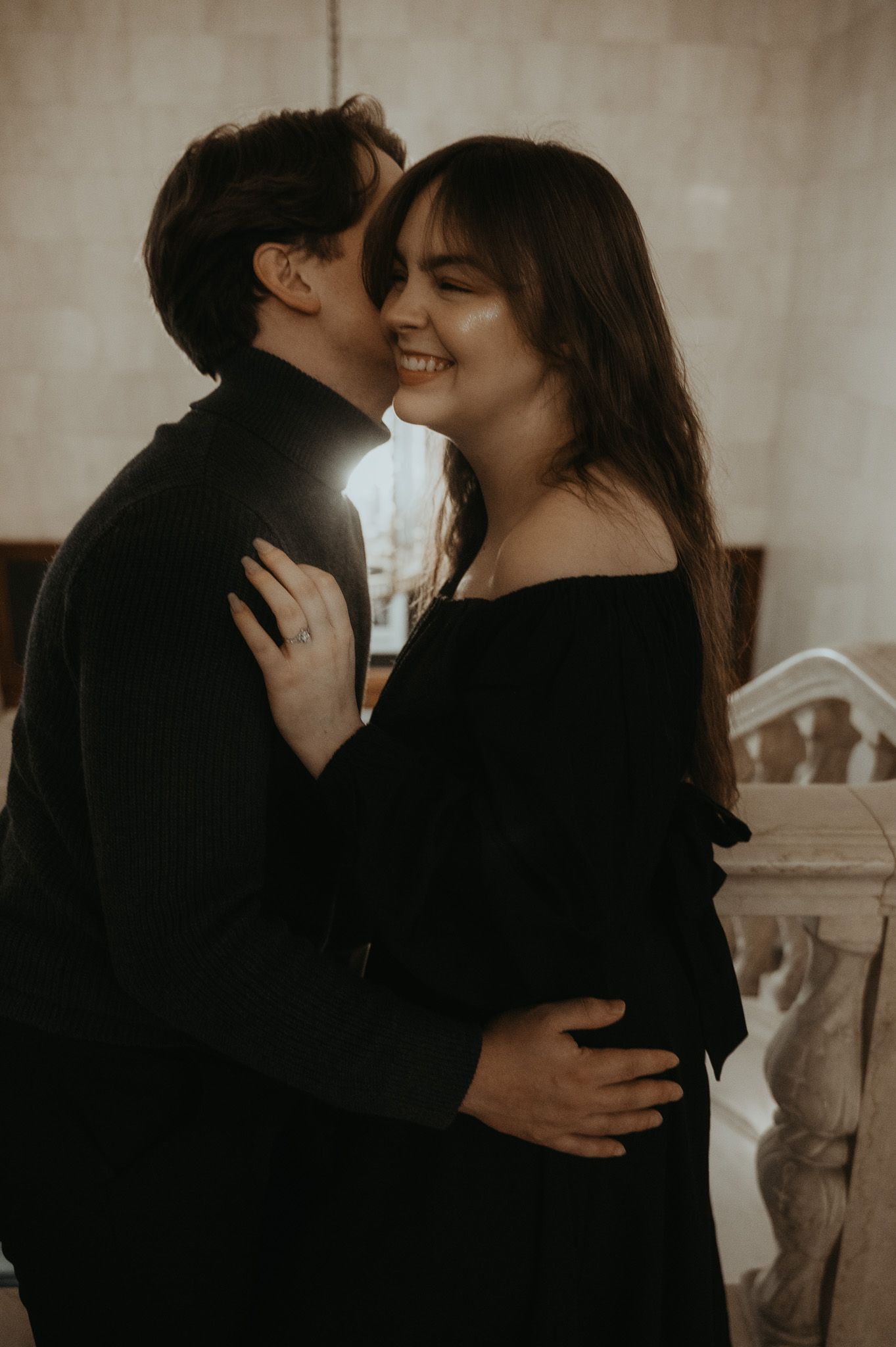 A romantic couple embraces and kisses in a series of sepia-toned photographs showing tender intimate moments.