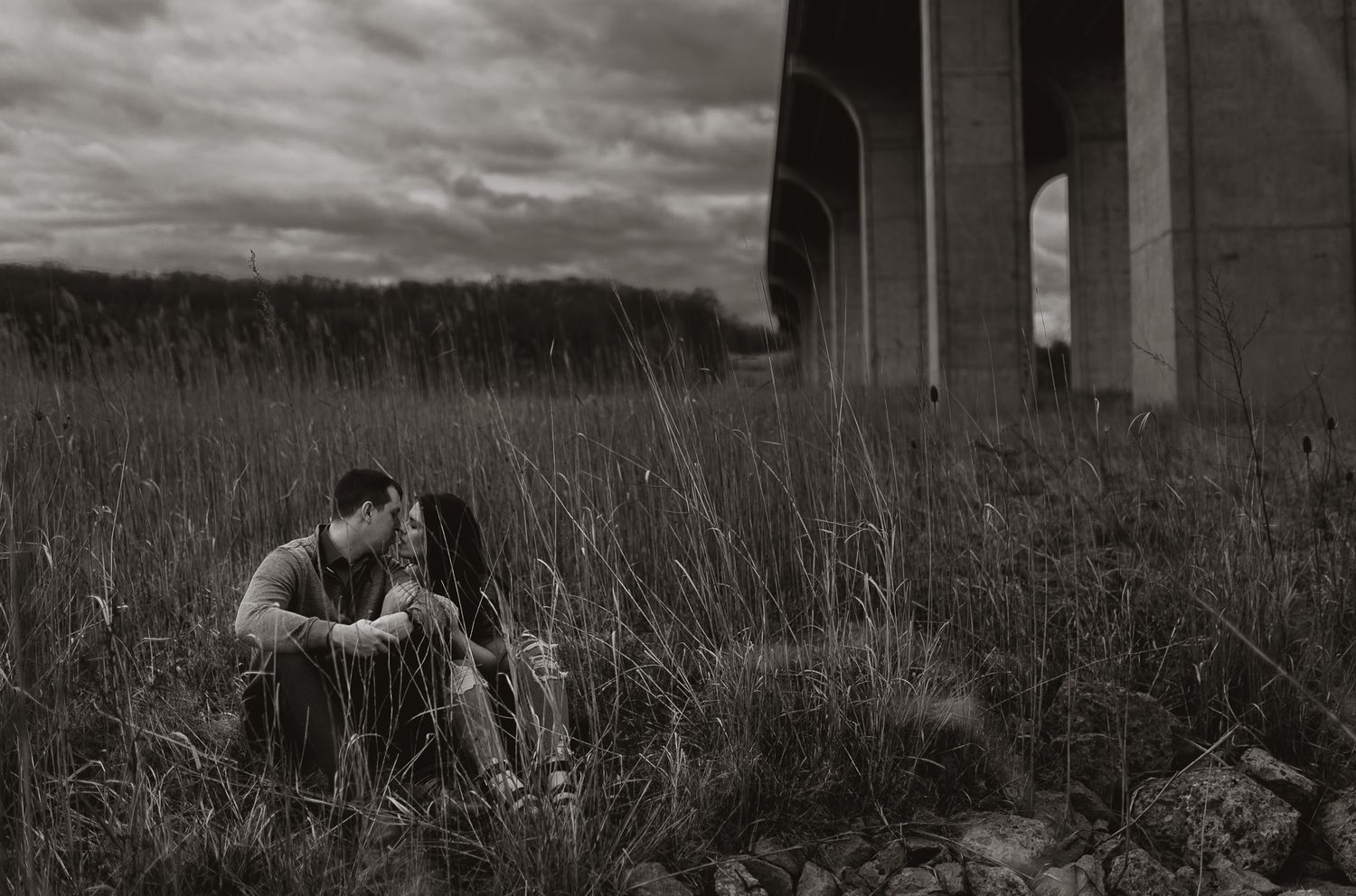 Dramatic architectural columns frame a romantic outdoor portrait session.
