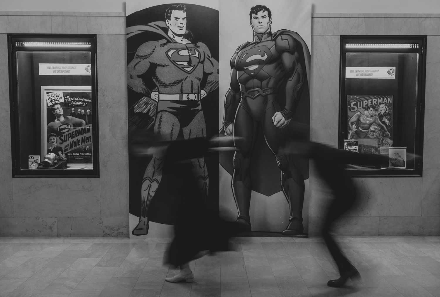 A sequence of black and white photos showing people walking past a storefront window in an urban setting.