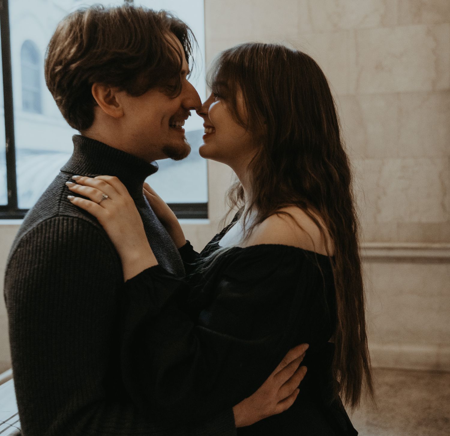 A romantic couple in an intimate embrace sharing tender moments in a series of black and white photographs.