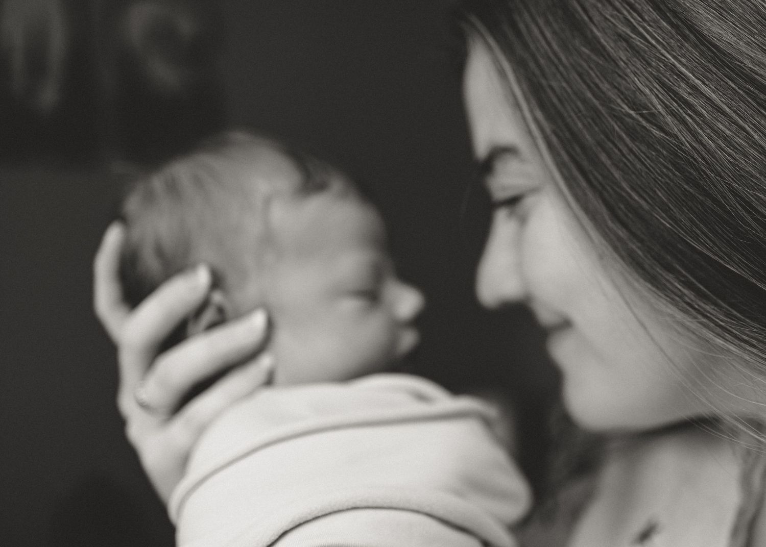 A romantic black and white photo series showing intimate closeup moments between a couple embracing.